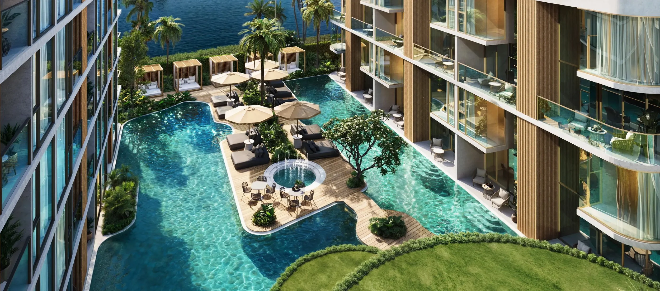 Siamese Bangtao pool deck with sun loungers, private cabanas, and direct pool access from ground floor units in Phuket