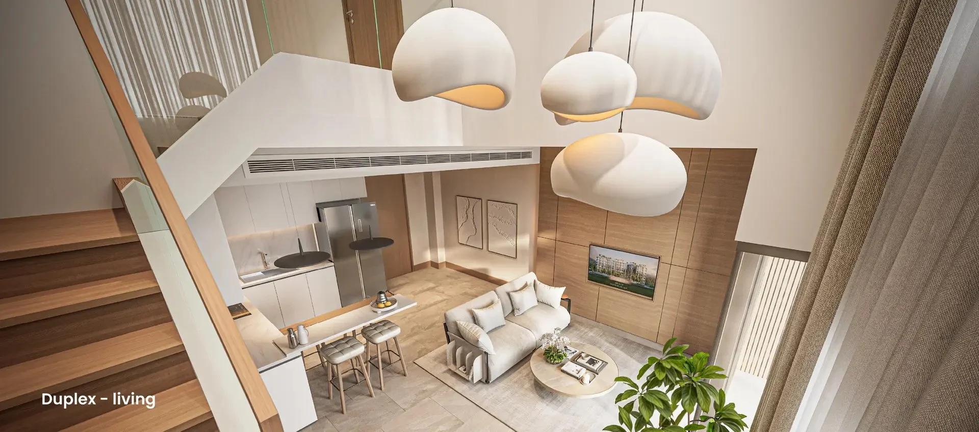 Stylish duplex living area at Siamese Bangtao with open-plan kitchen and modern furnishings