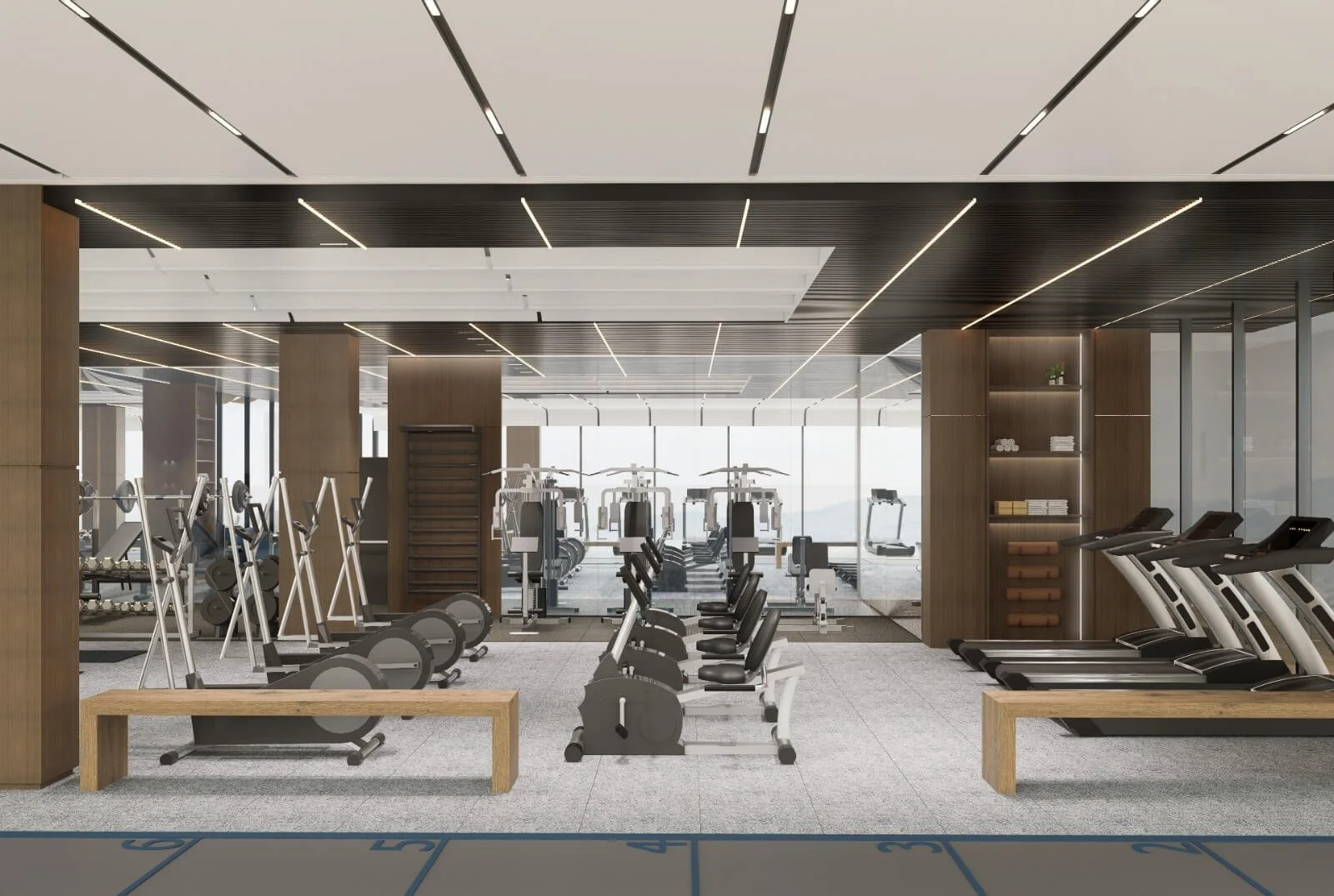 State-of-the-art fitness centre at Abov Patong condominium, featuring treadmills, weight machines, and panoramic mountain views