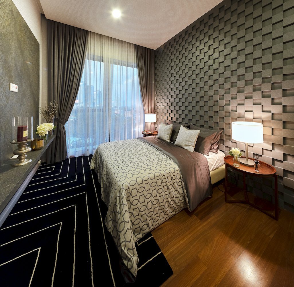 Bedroom interior at The Astaka Johor Bahru featuring modern design and soft lighting.