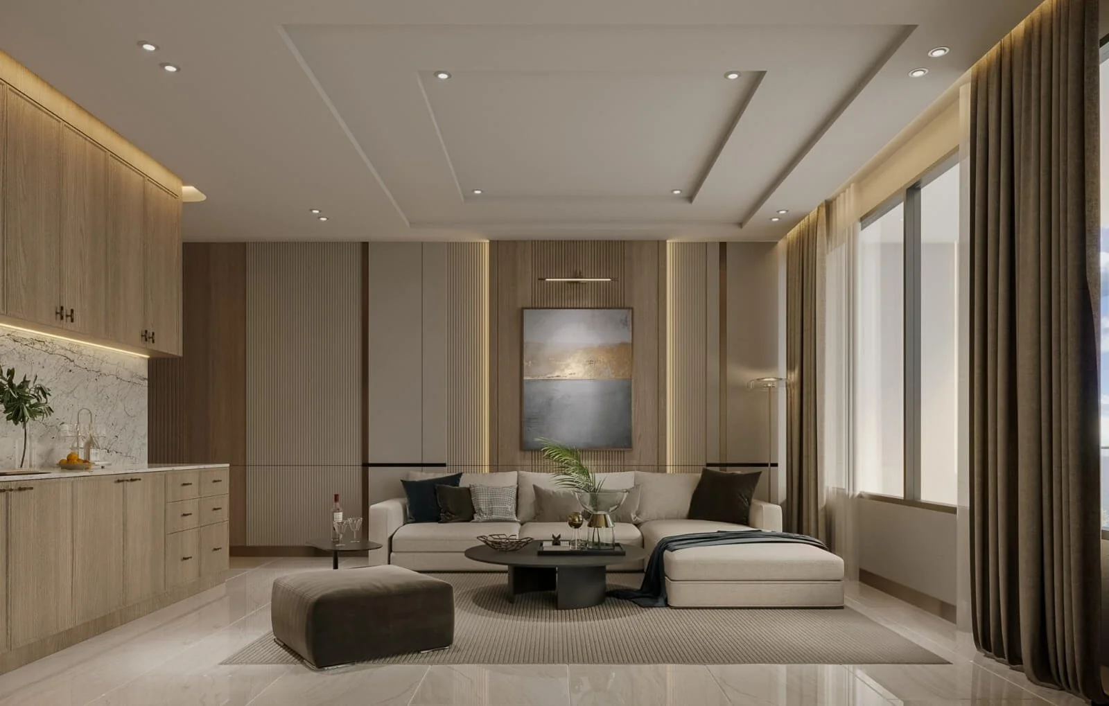 Open-plan suite at Abov Patong with integrated kitchen and lounge, showcasing neutral tones and modern furnishings