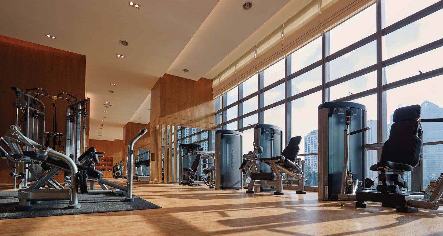 State-of-the-art fitness centre with skyline views at The Ritz-Carlton Residences Kuala Lumpur.
