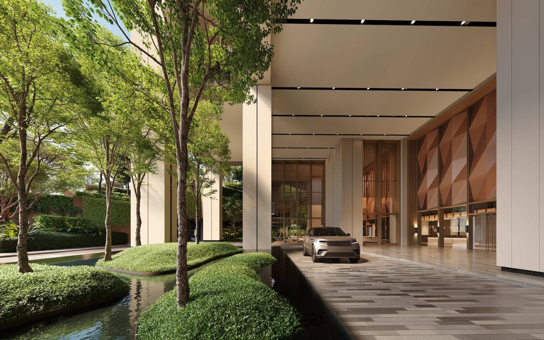 The Lume by E&O drop-off entrance at Andaman Island with landscaped arrival area and double-height lobby façade.