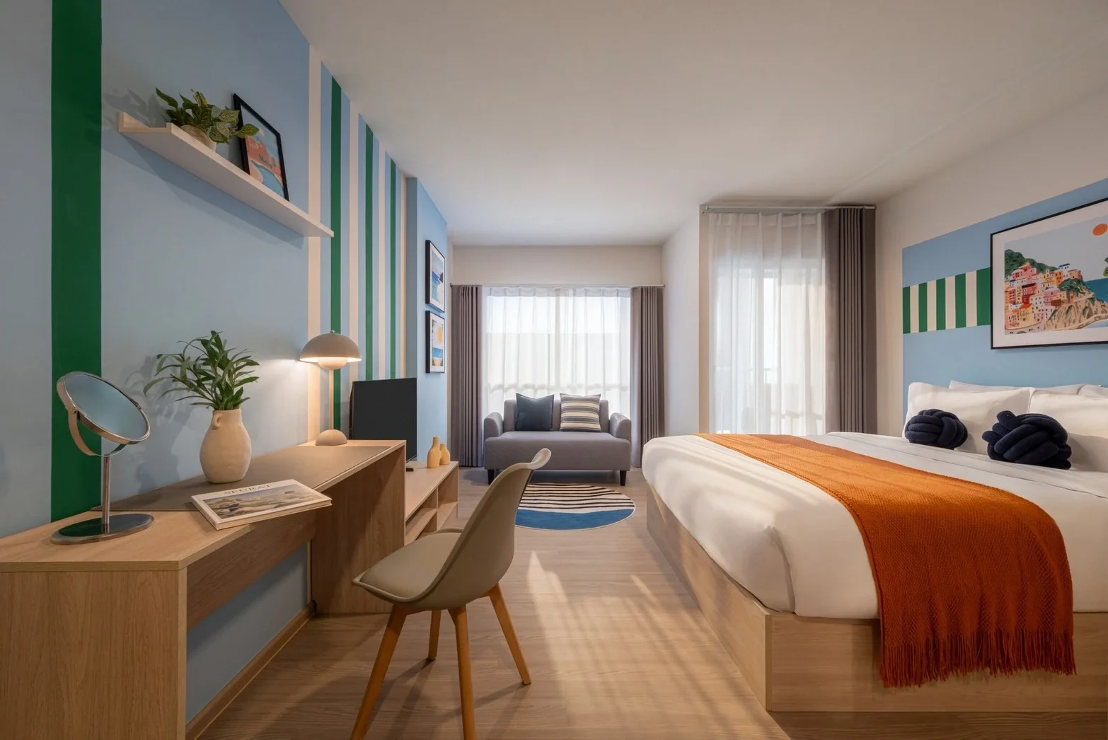 Studio condominium interior at Hub Hua Hin with colourful contemporary décor and bedroom living space.