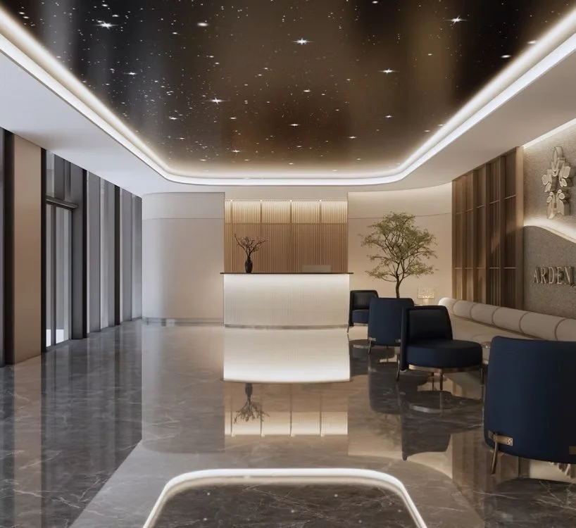 Lobby and reception lounge at The Arden with seating and feature ceiling lighting.