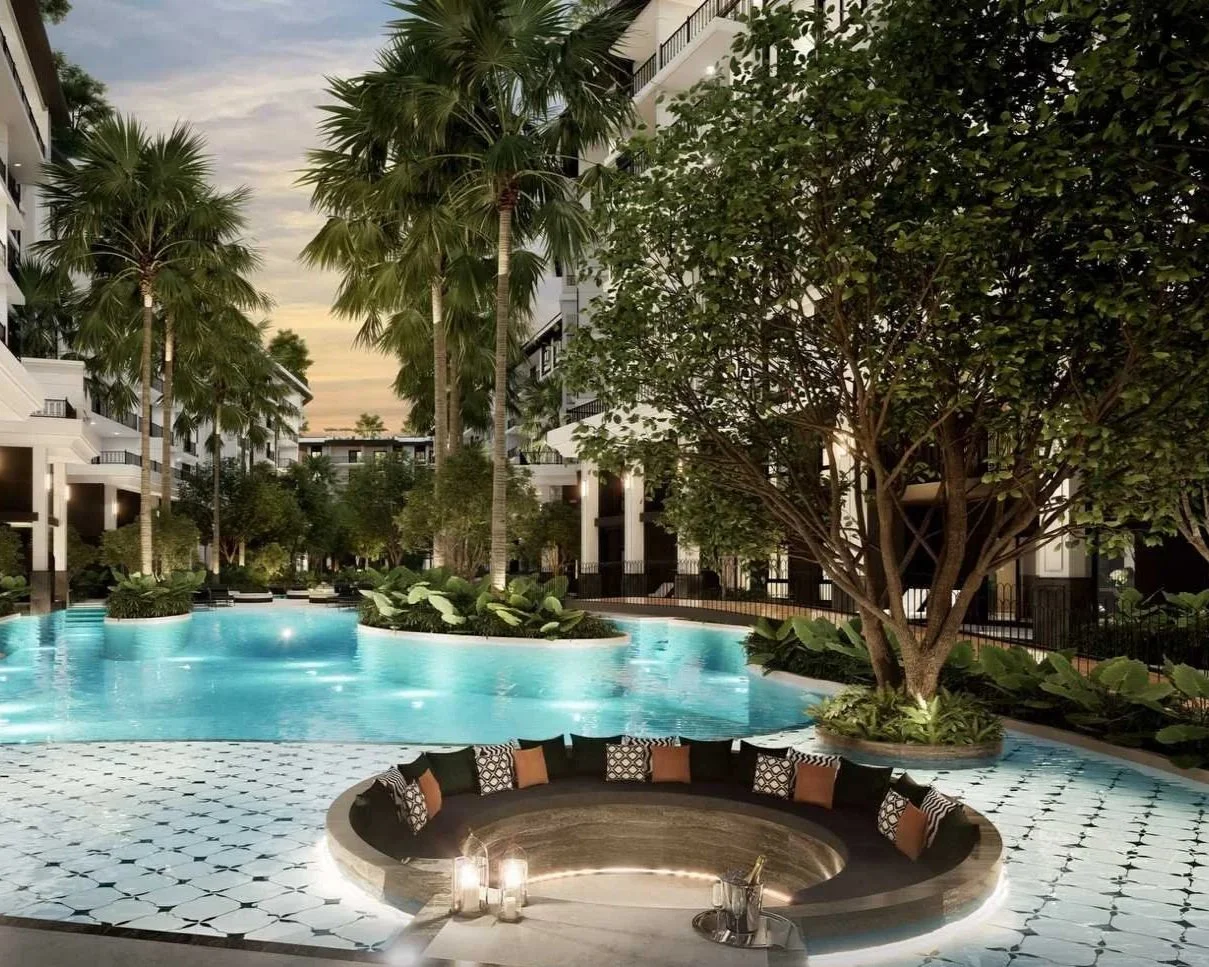 The Title Heritage Bang Tao, pool area with seating area and palm trees.