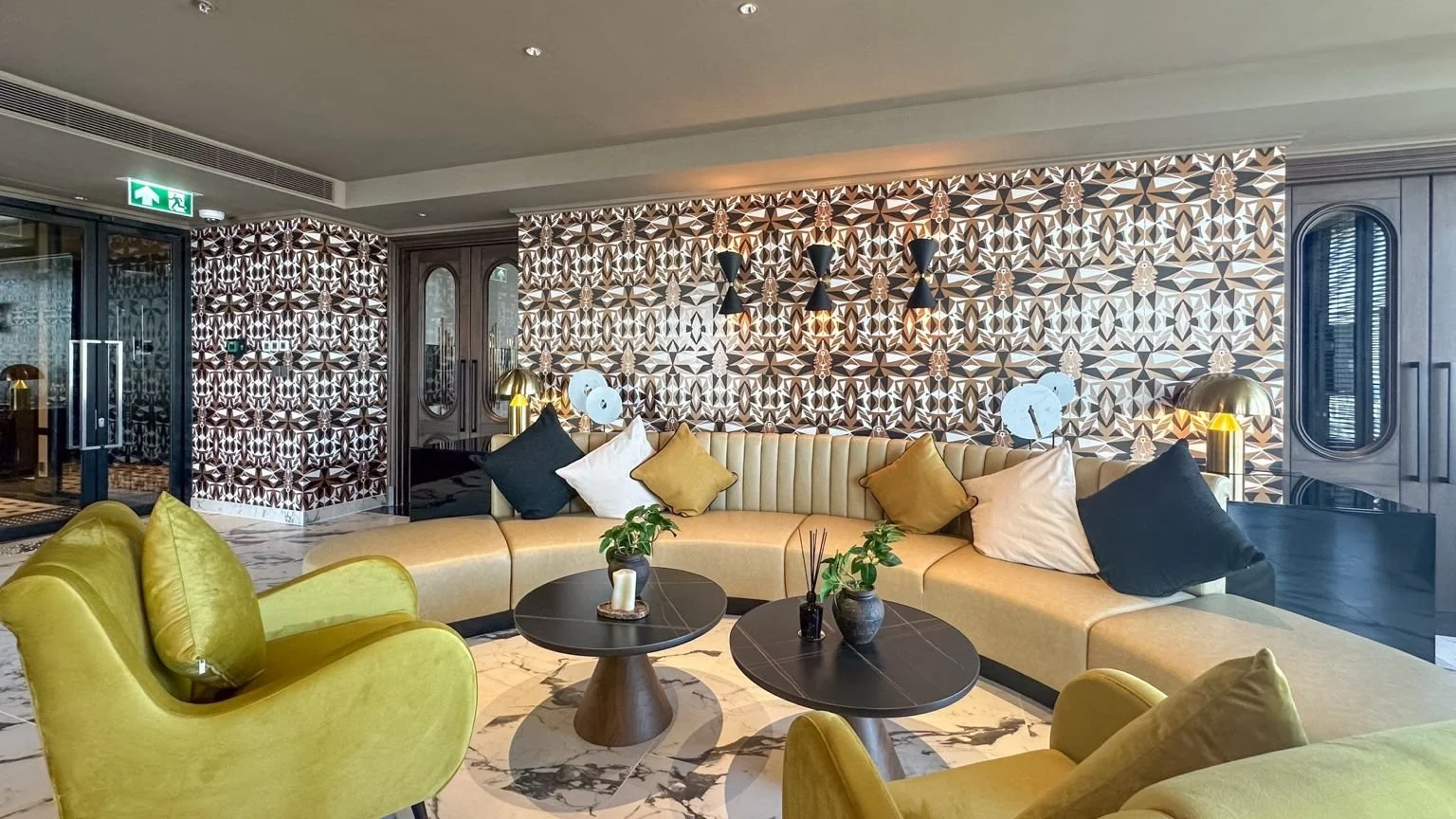 Multipurpose social space at Noble Form Thonglor with lounge seating and communal area.