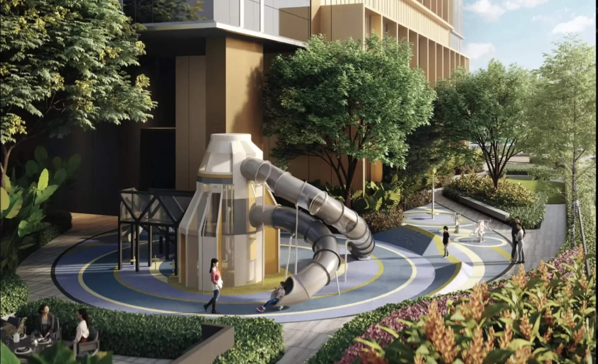 Children’s outdoor playground at The Arden with slide and landscaped seating areas.