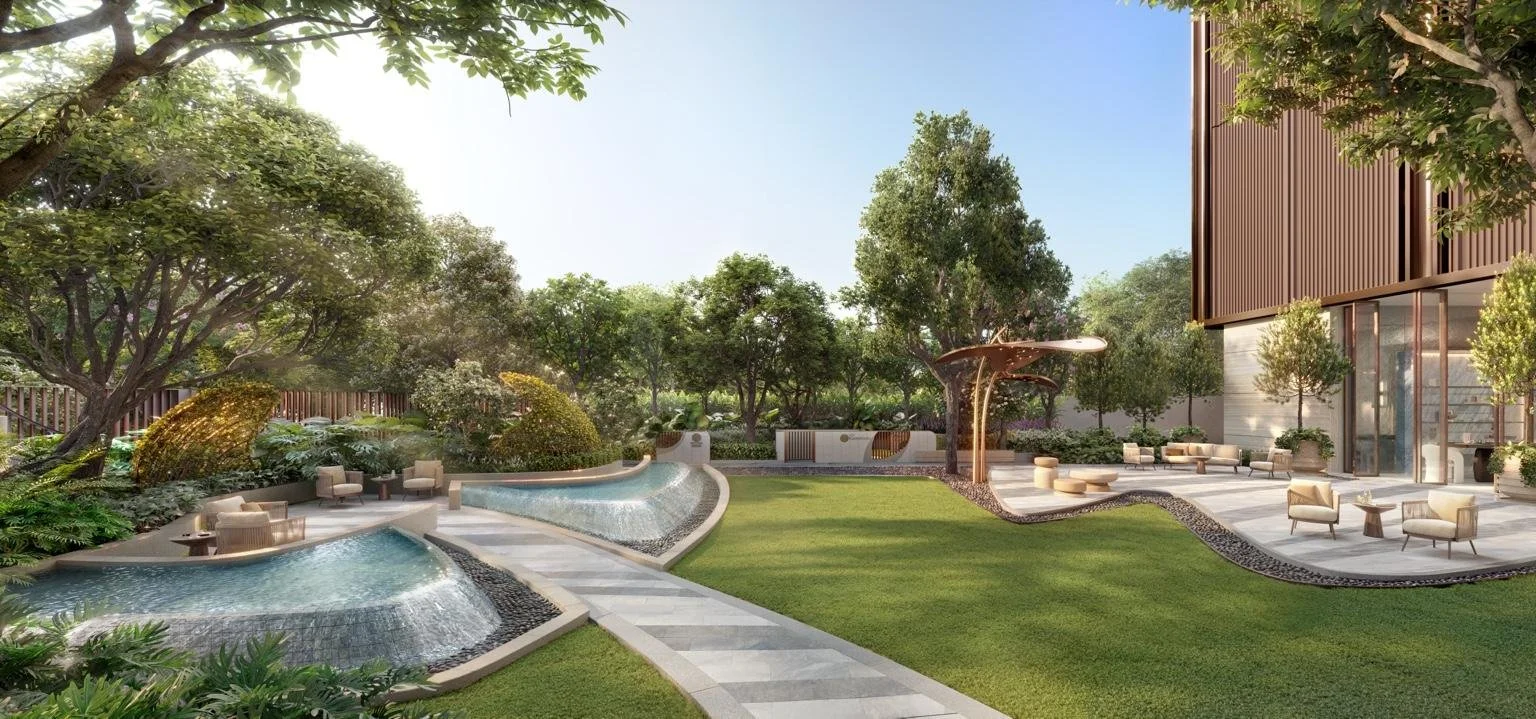 Landscaped garden and private park area with seating and water features at Widen by Sansiri.