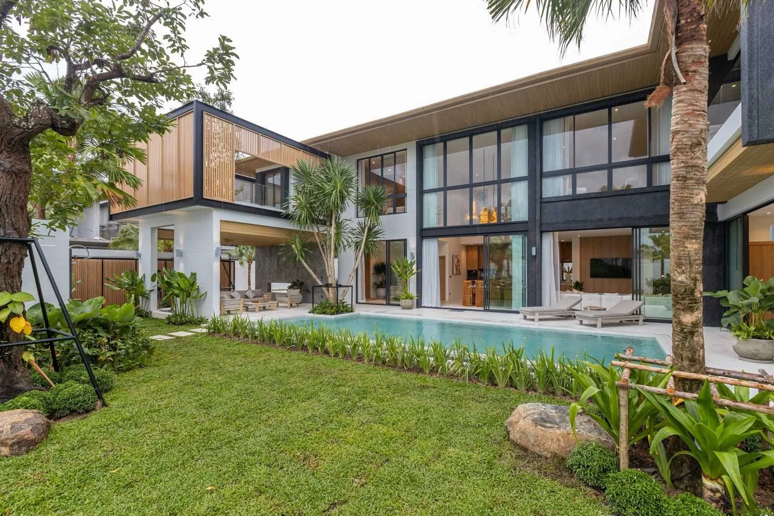 Mouana Grande luxury villa exterior, tropical gardens and private pool.