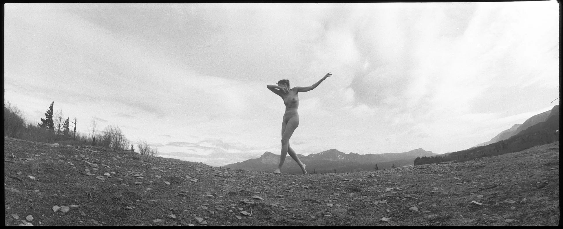 Fine art nude photographed with a Panon Widelux F8 and Fomapan 100 35mm black and white film outdoors in Oregon