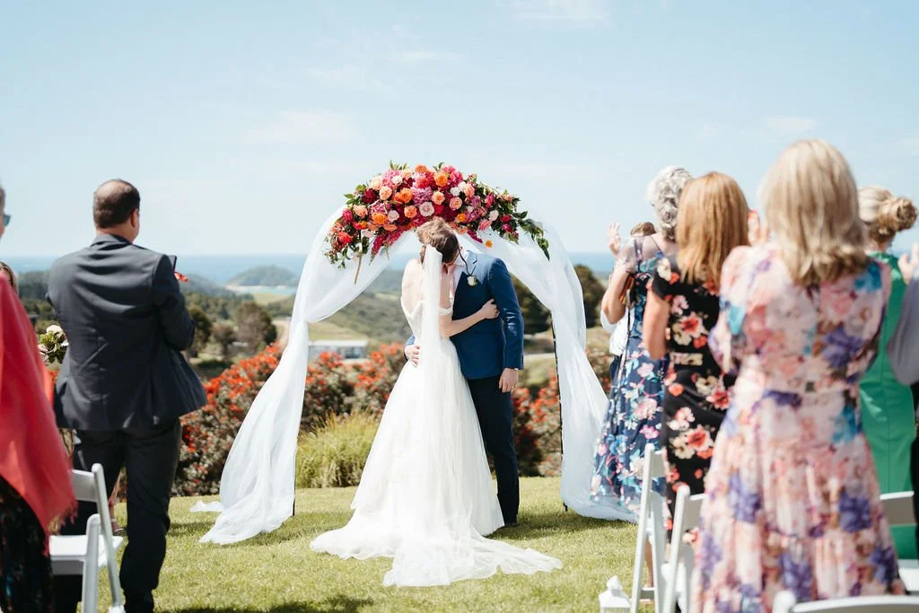 the matrimonial ceremony with the ocean as the horizon and the matapouri beach hills as witness to love and un ion