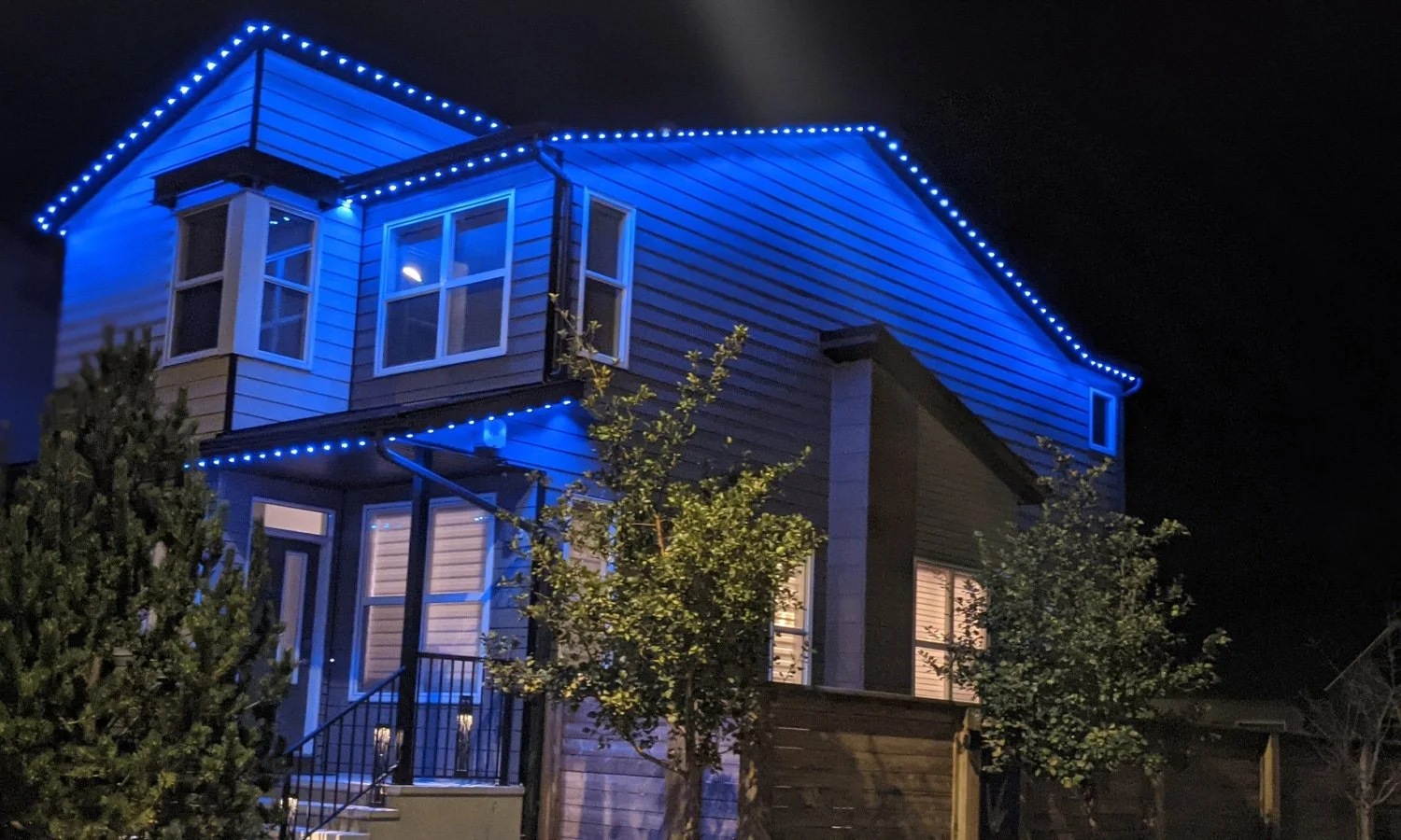 South Bismarck home with permanent lighting along roofline and pathways