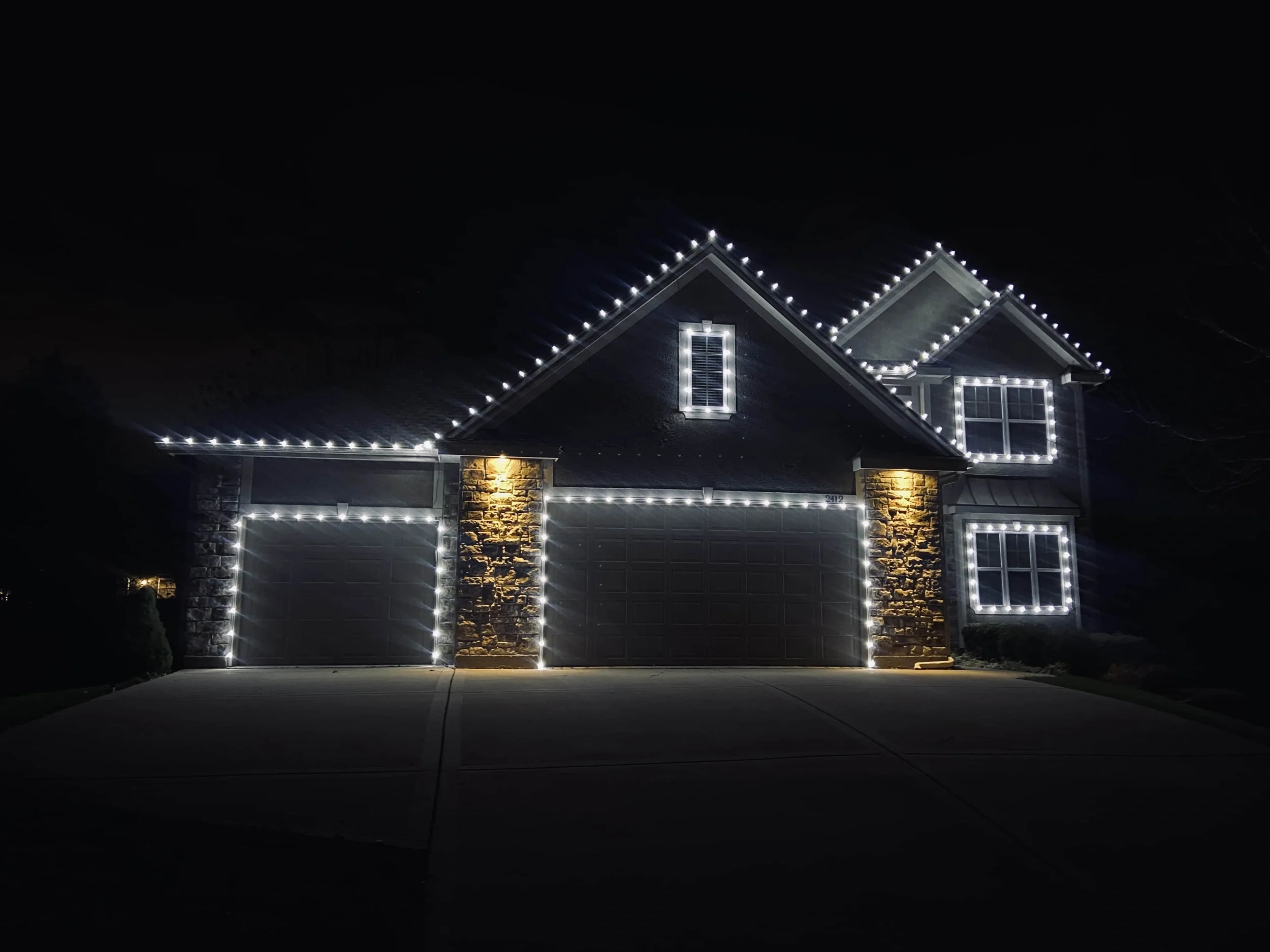 North Bismarck home with custom Christmas lighting on roof and landscaping