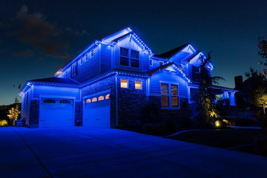 Permanent exterior lighting installation on a ranch-style home in Mandan – professional residential lighting service