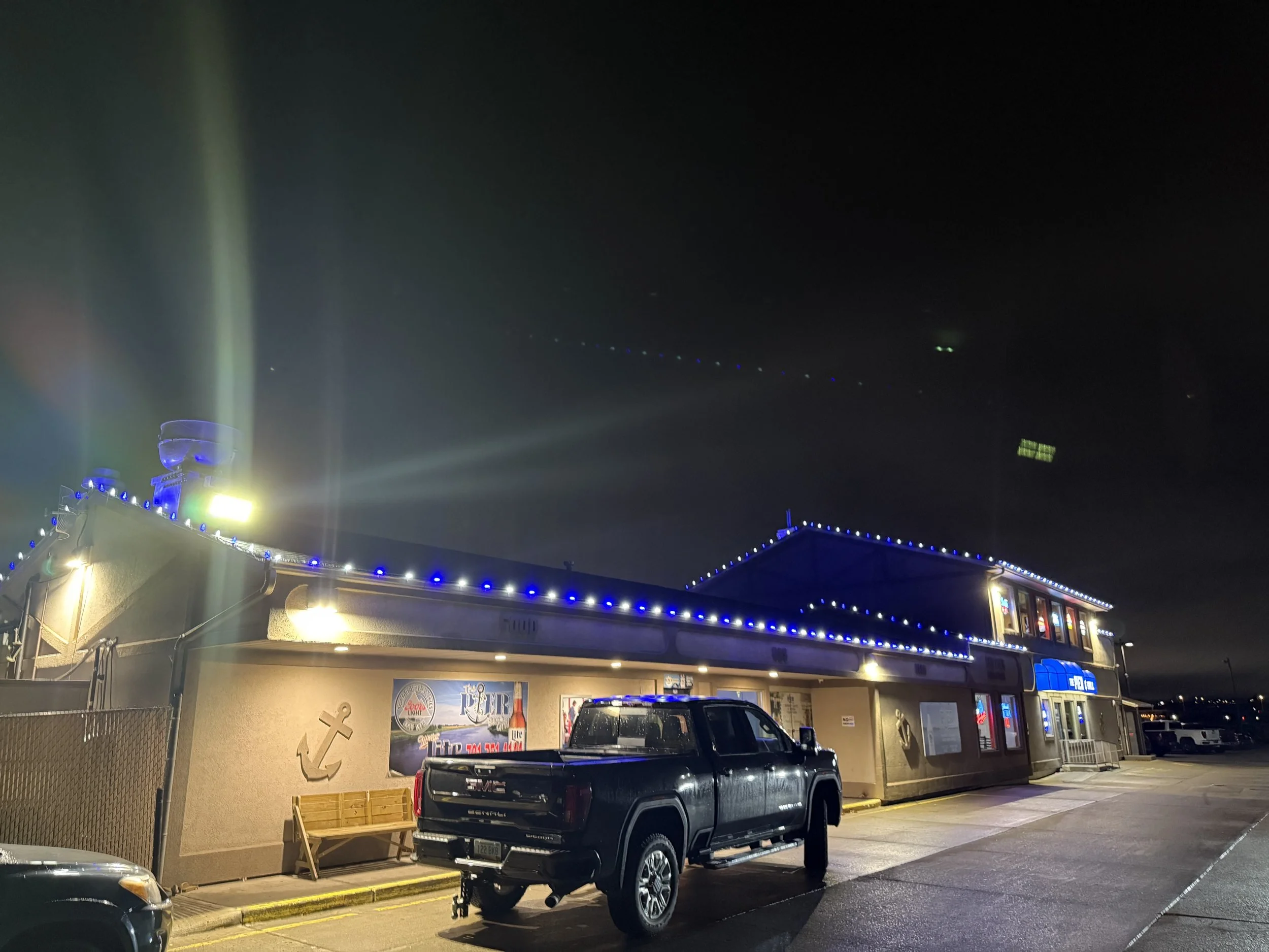 Tree and roof Christmas lights installed in Promontory Point South Bismarck