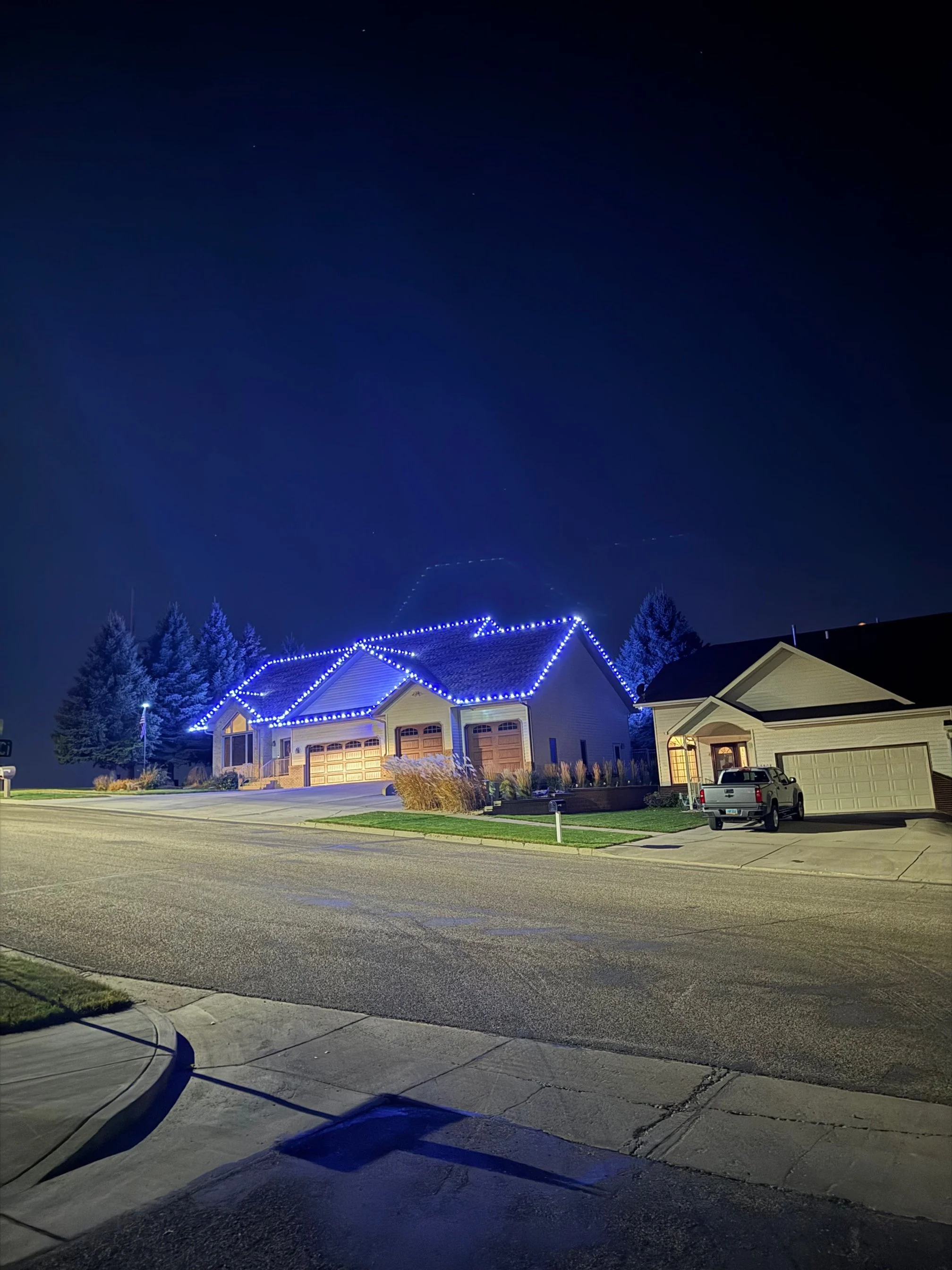 Top pick residential Christmas light installation in Bismarck with blue and white LED lights – professional holiday lighting for homes
