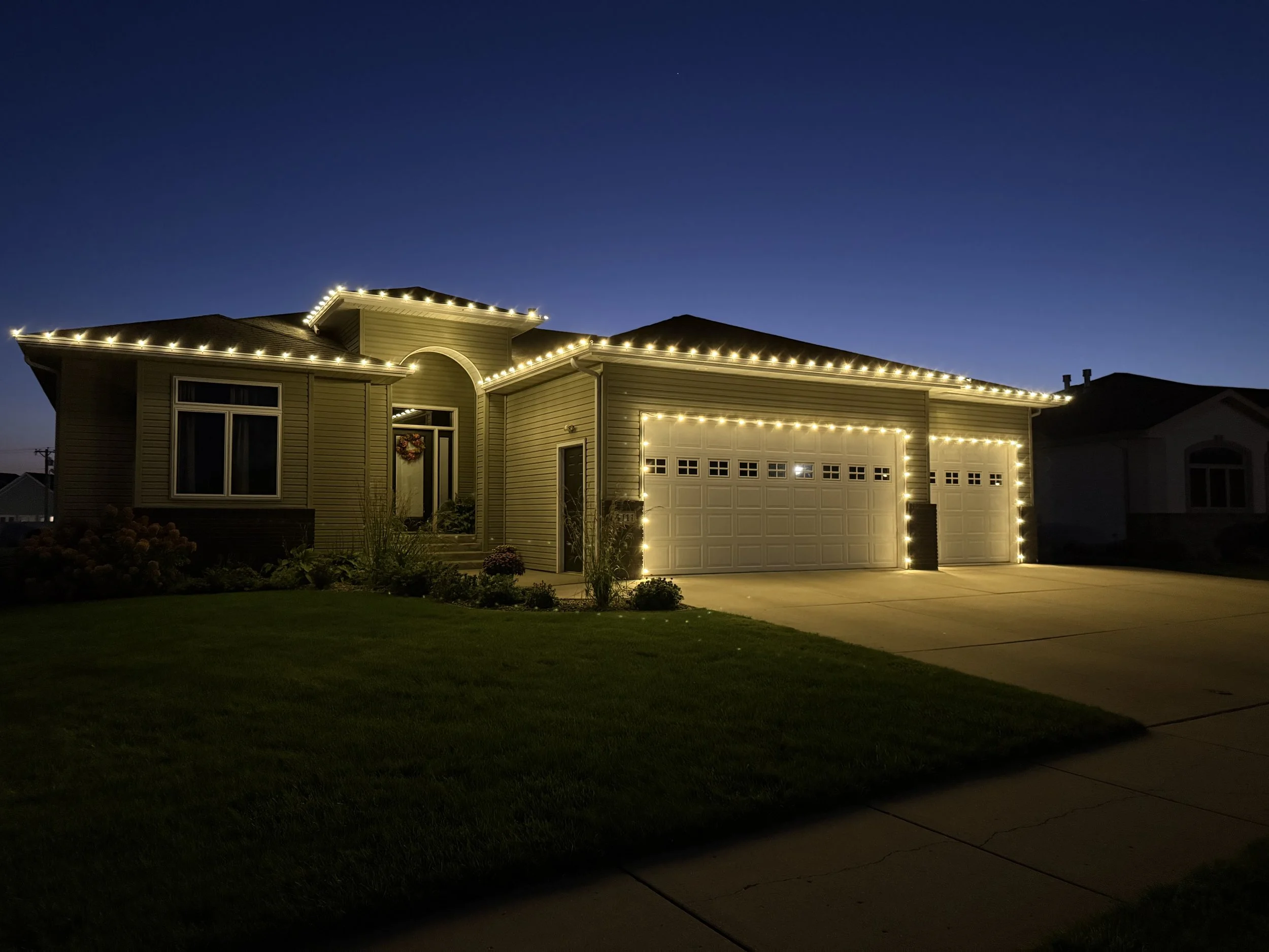 Second choice residential Christmas light installation in Mandan with warm white LED lights – professional holiday lighting service