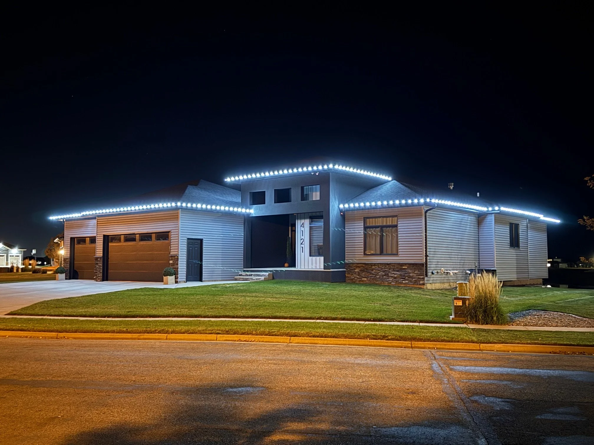 Custom roofline Christmas lighting in Whisperwood South Bismarck