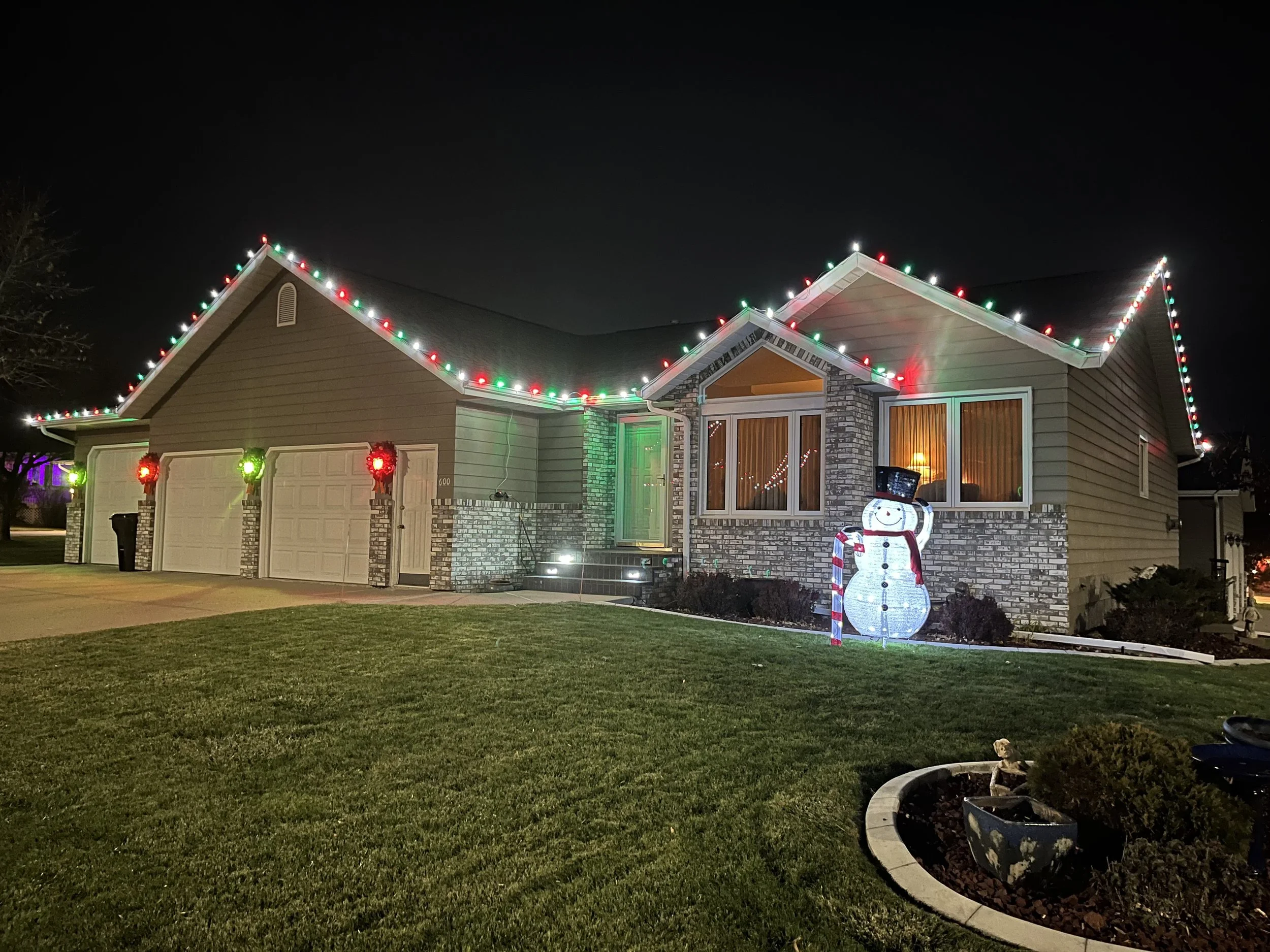 Festive Christmas light installation on a home in North Bismarck ND