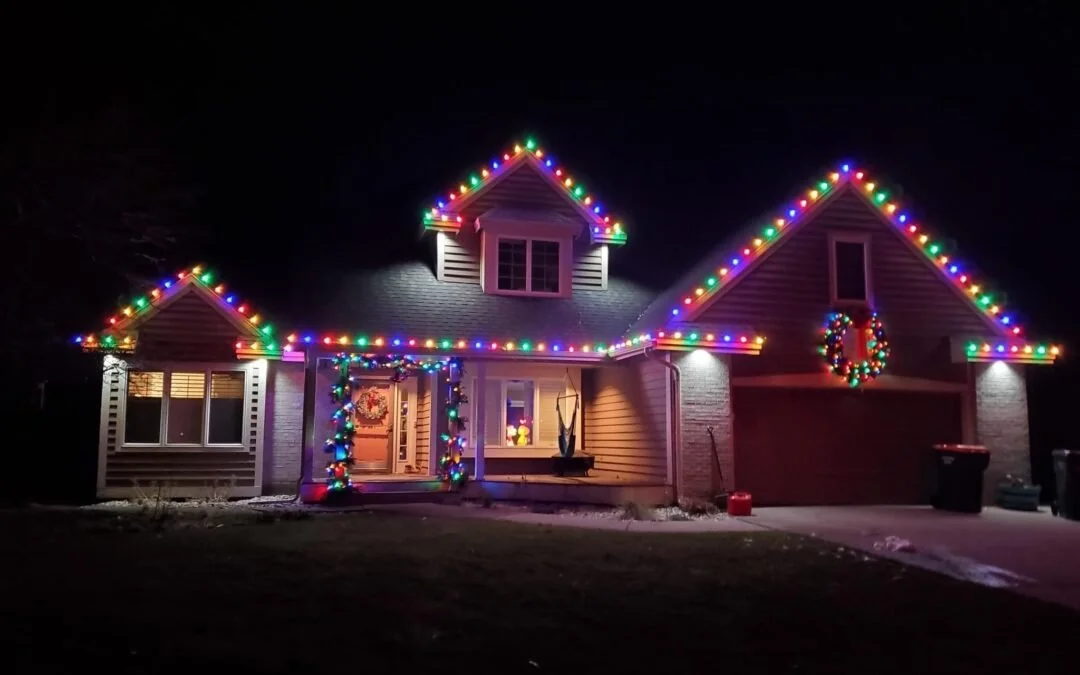 House in Mandan decorated with multicolor LED Christmas lights – professional residential holiday lighting installation
