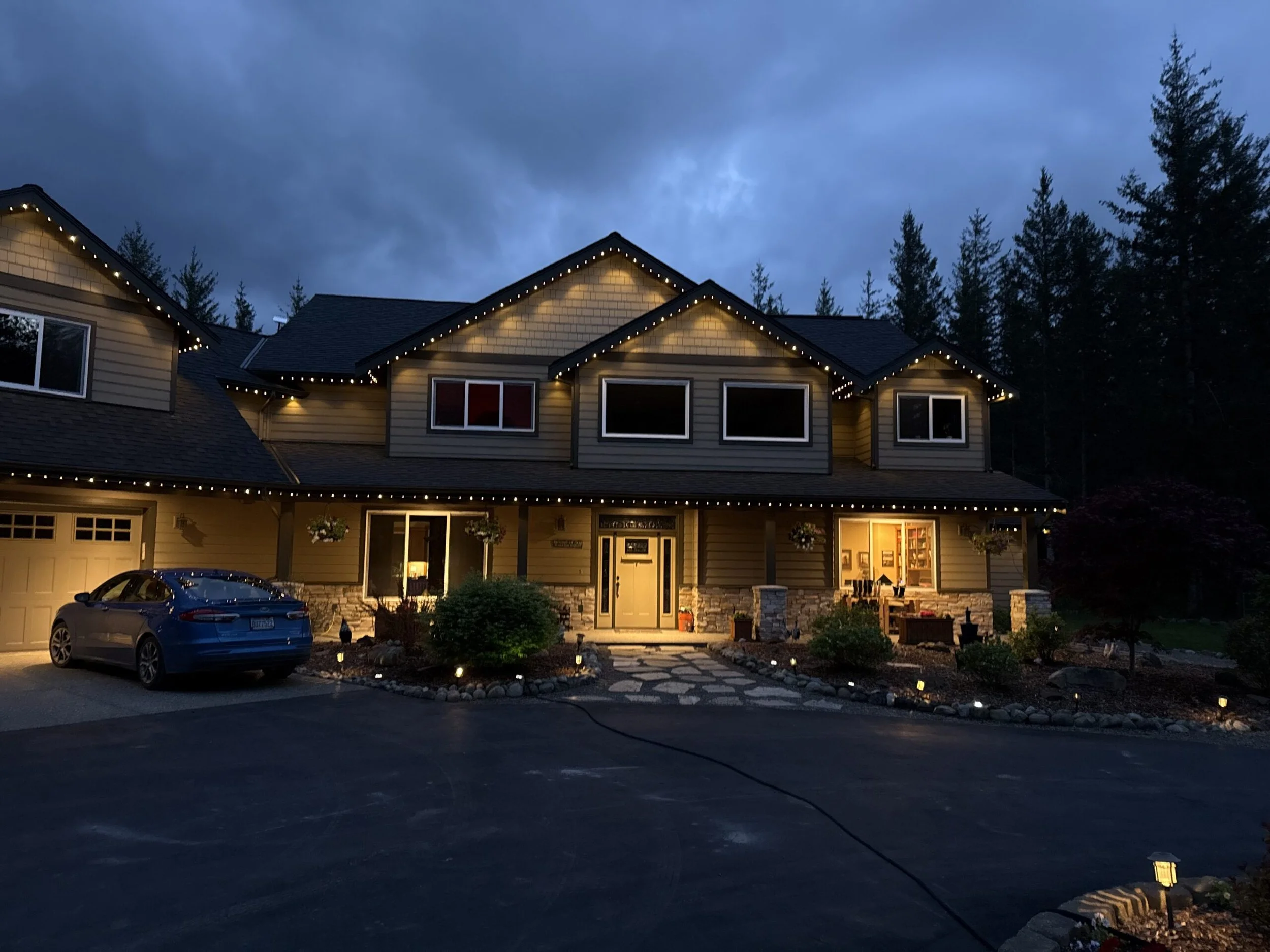 Permanent LED lighting installation on a Mandan home highlighting rooflines and landscaping mandan_custom_lighting.jpg Custom outdoor lighting in Mandan, ND with energy-efficient LED lights
