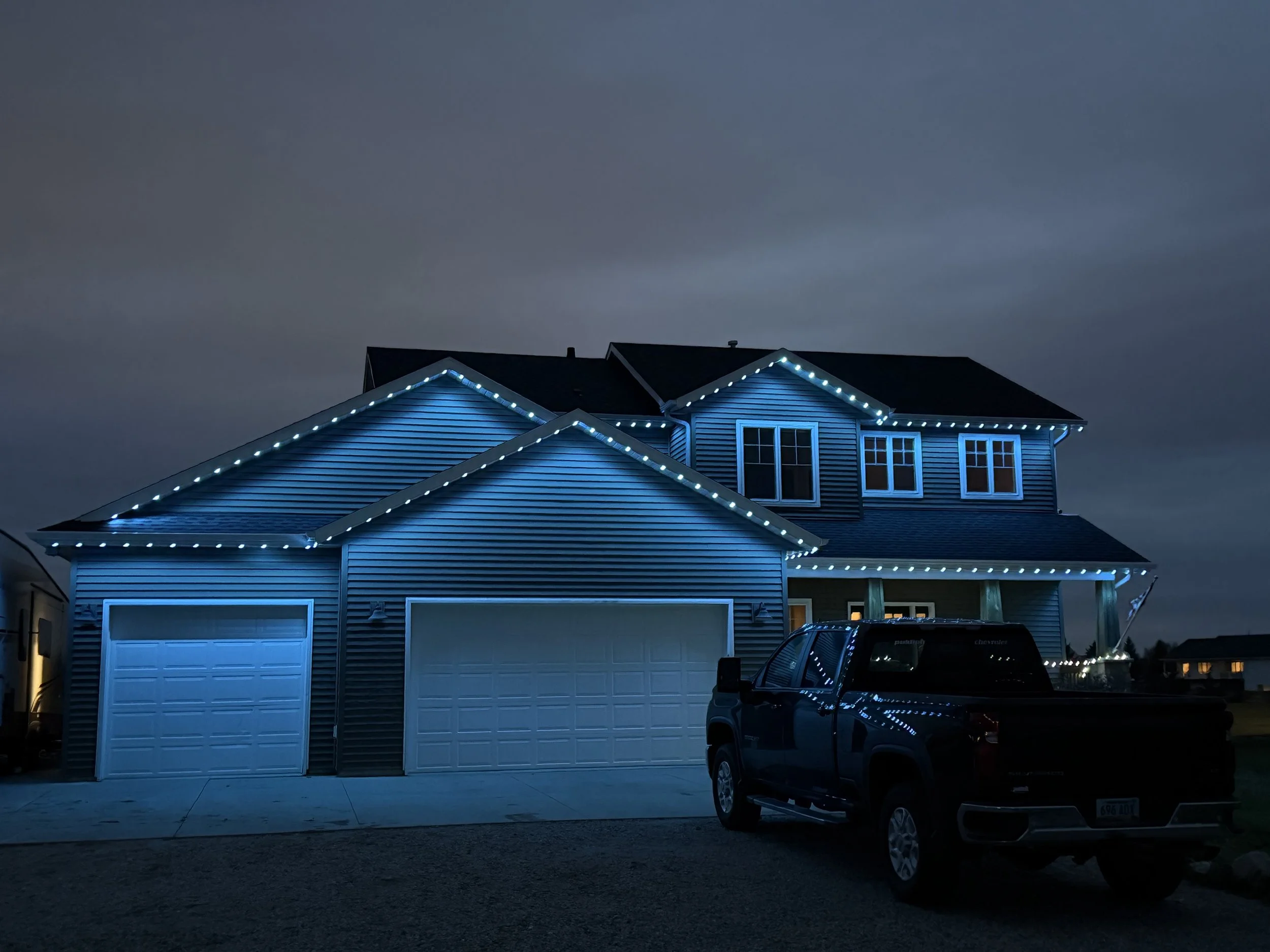 Permanent lighting installation on a historic home in Mandan – professional residential exterior lighting service
