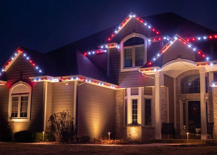 South Bismarck home with roofline and pathway permanent lighting in Cottonwood