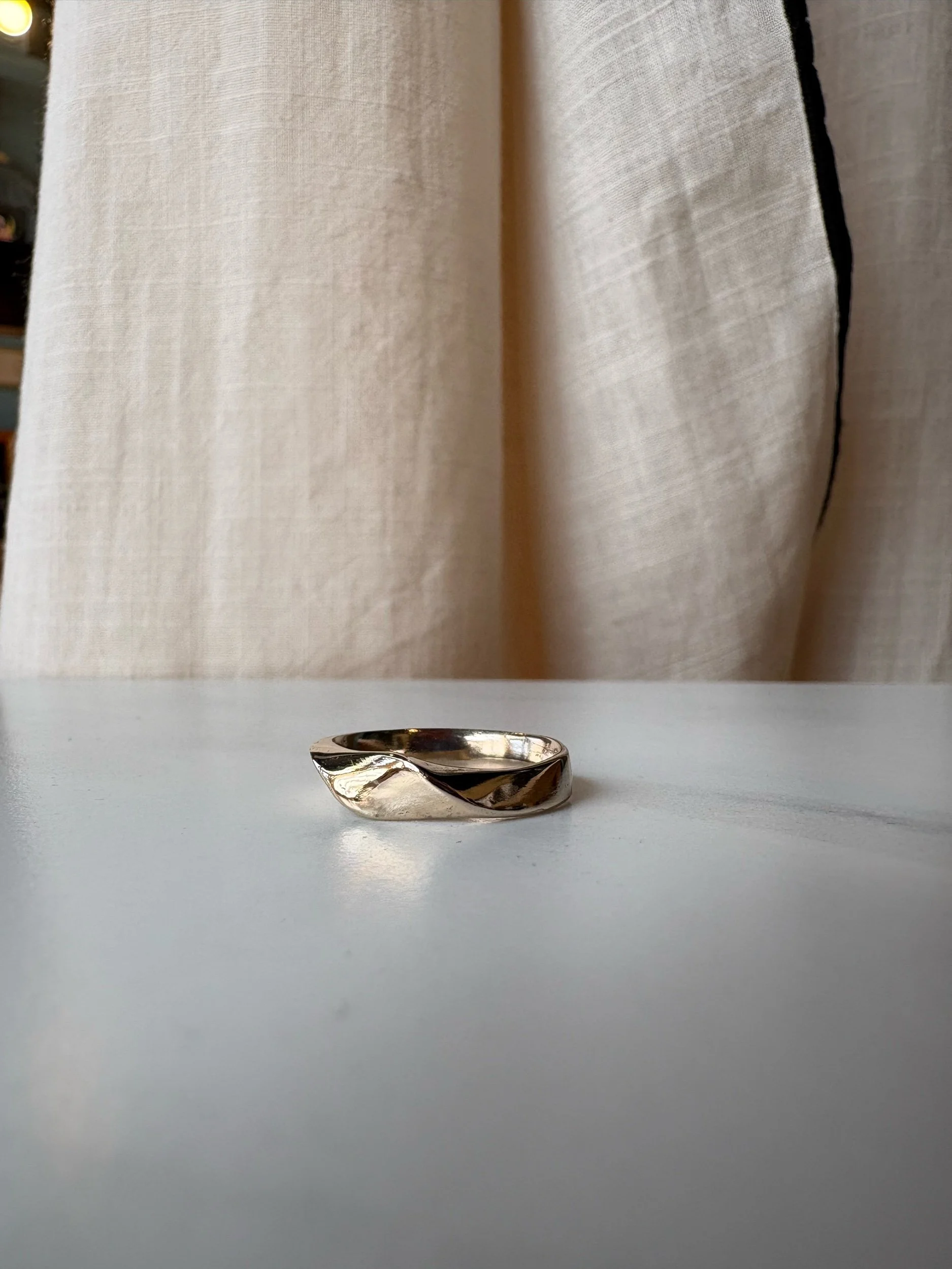 Gold band with a twist, using customer's own gold.
