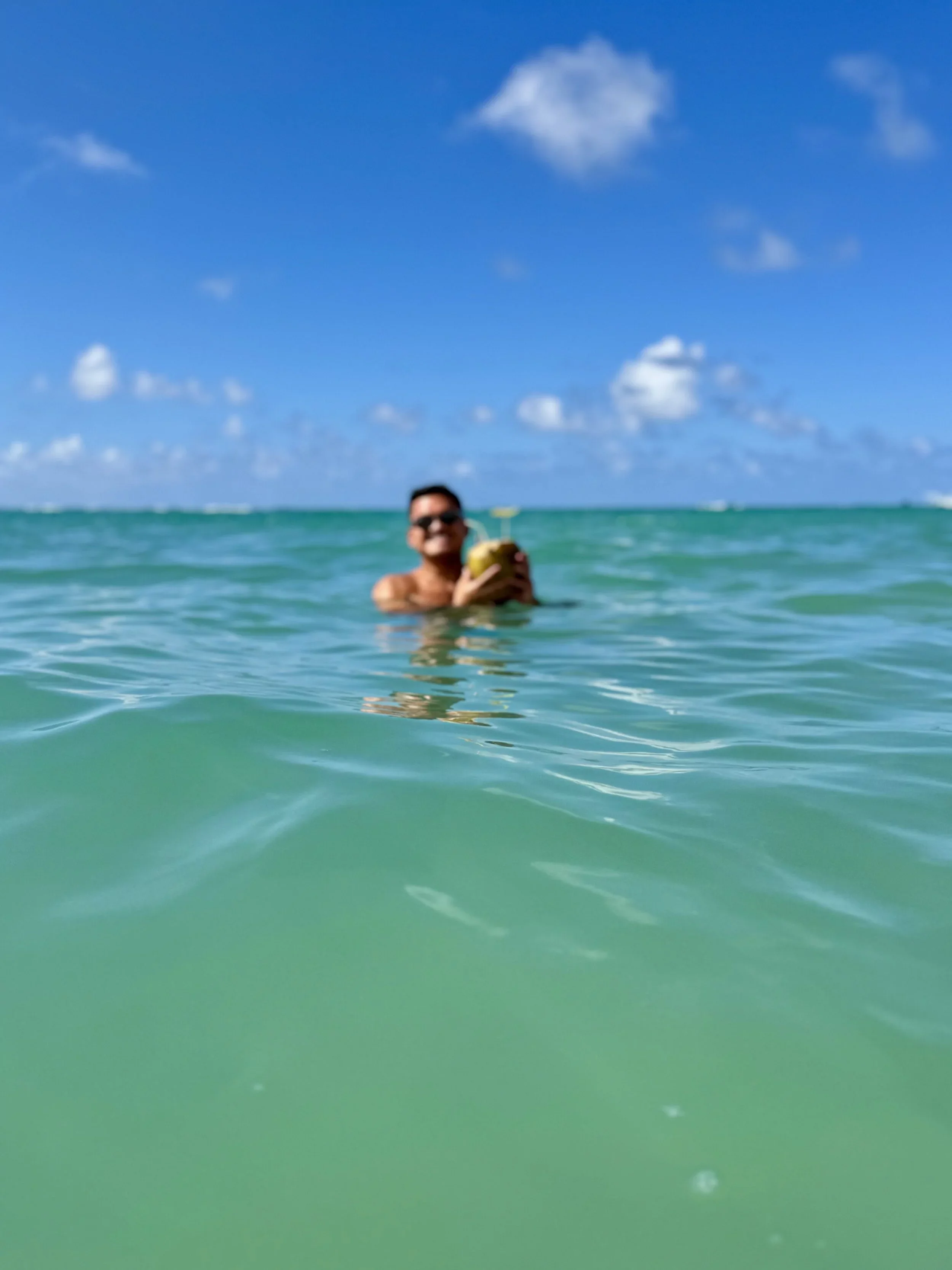 Rich Clum, award-winning marketing leader, author, and pilot, photographed in the ocean in Puerto Rico.