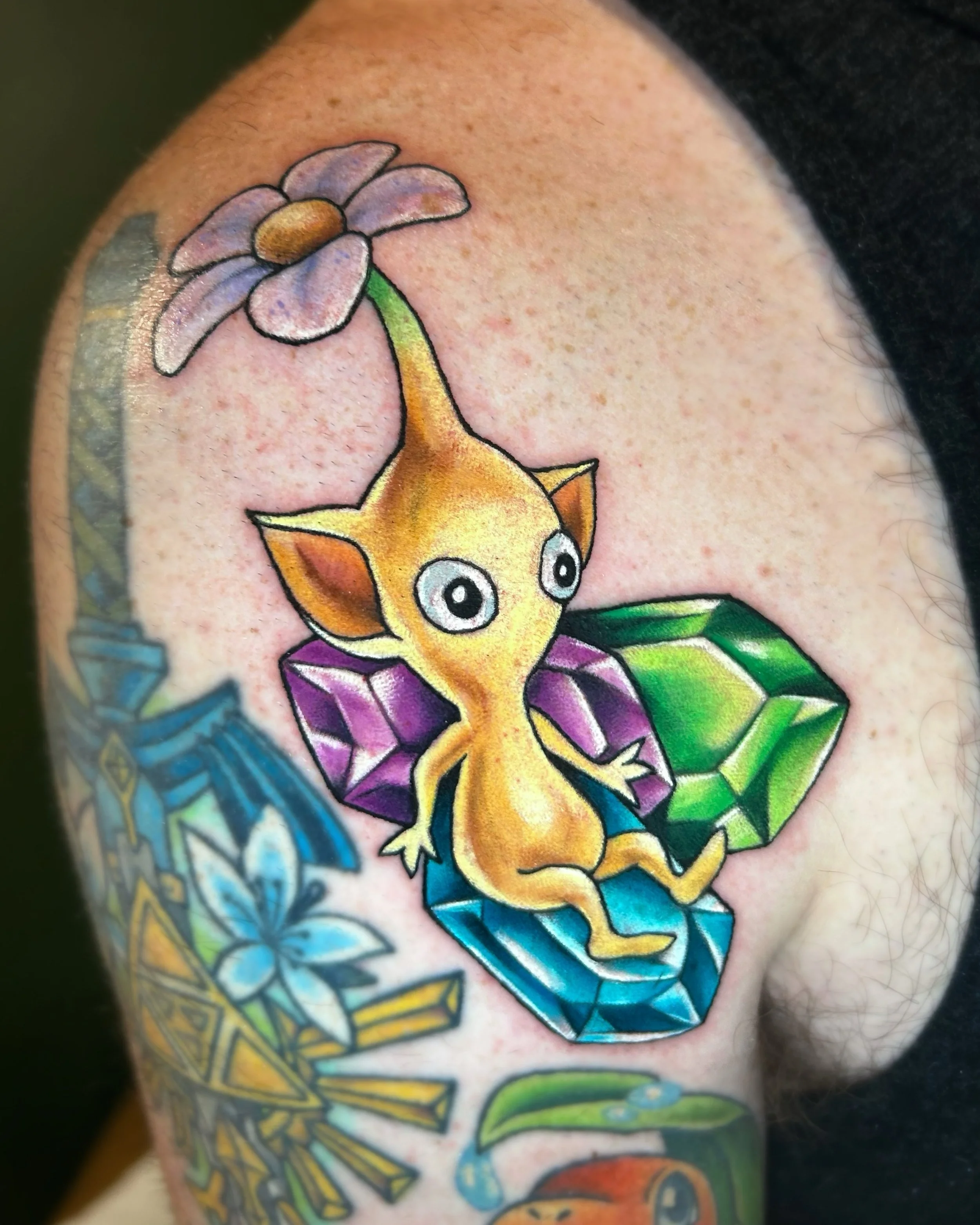 🌼💎💣

Yellow Pikmin on some Rupees from Legend of Zelda and a Bobomb from Mario! Got to add these sweet little guys to this in progress half sleeve recently! Thank you so much Sam for sitting for these friends! Can&rsquo;t wait for the next round o