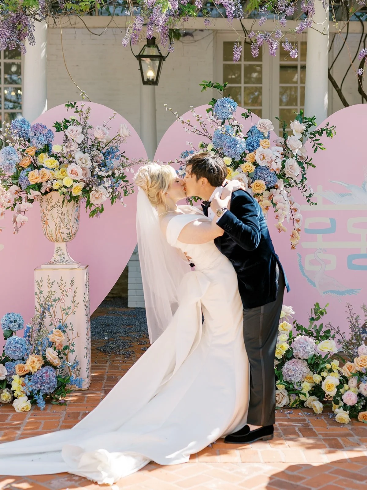 Some pieces don't just fill a space, they define it.

Our pink chinoiserie urns and pedestals create moments that feel intentional, whether they're framing a ceremony, welcoming guests, or bringing a collected layer of pattern and charm to the bar.

