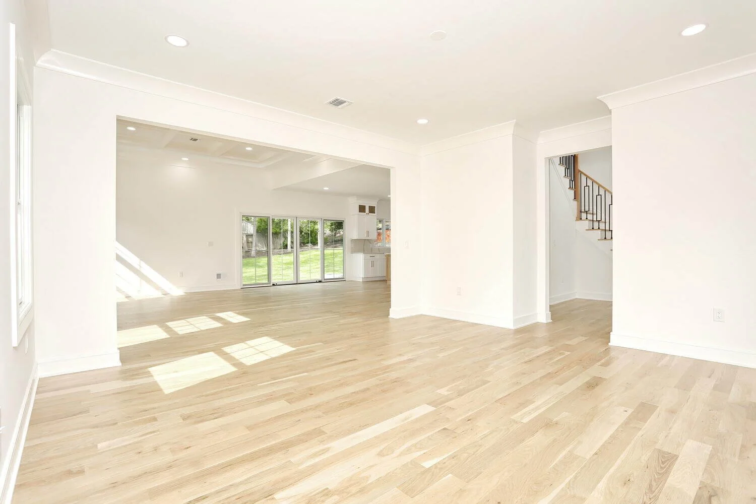 Open dining area with bright natural light and seamless flow into the kitchen and backyard in a Park Ridge modern farmhouse by Dadak LLC.