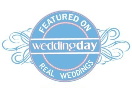 Logo with a blue circle, featuring the text 'Featured on wedding day real weddings' in white and pink accents, with decorative blue swirls.