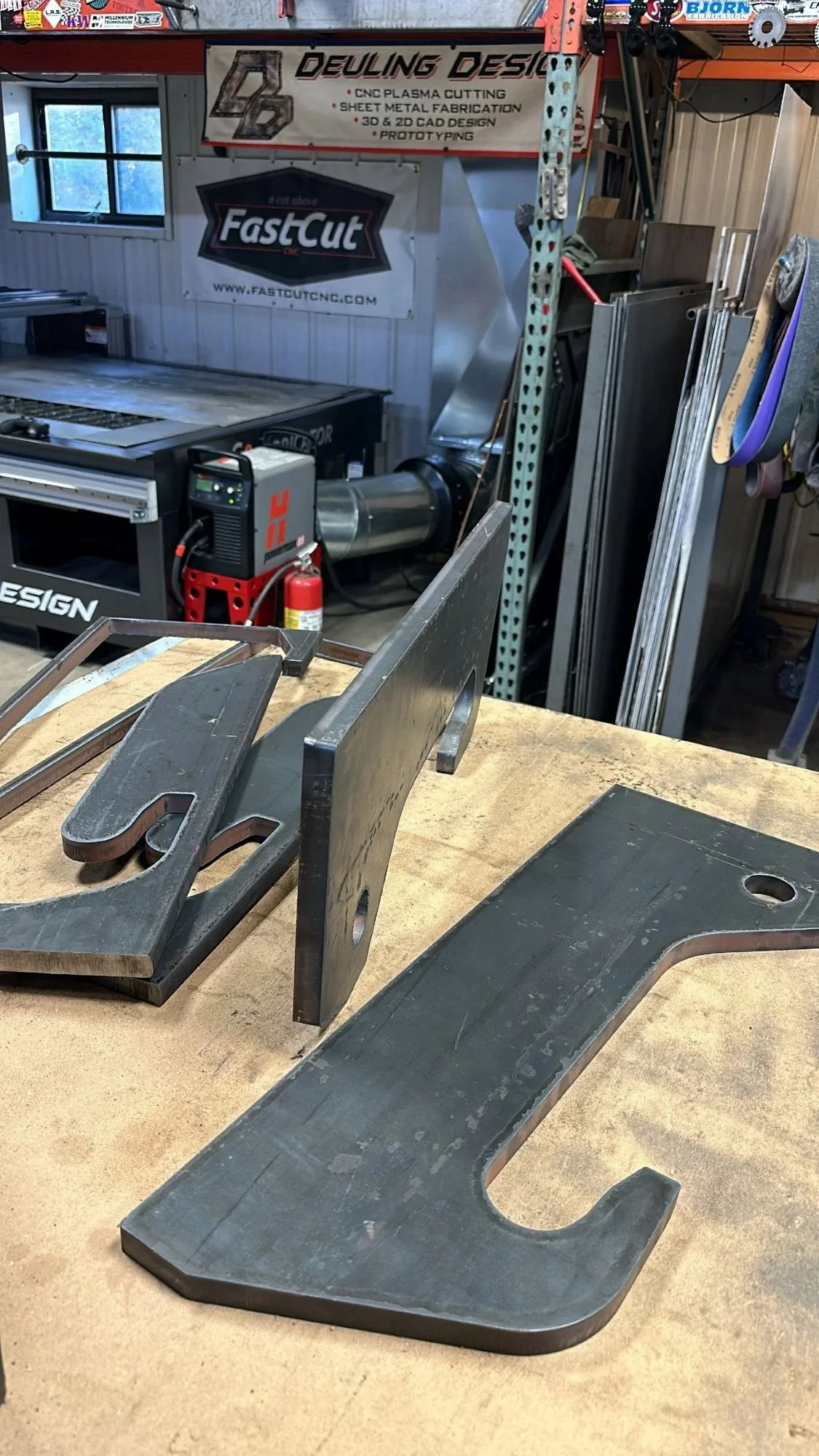 Heavy-duty CNC plasma-cut 3/4-inch steel components prepared for custom fabrication project.