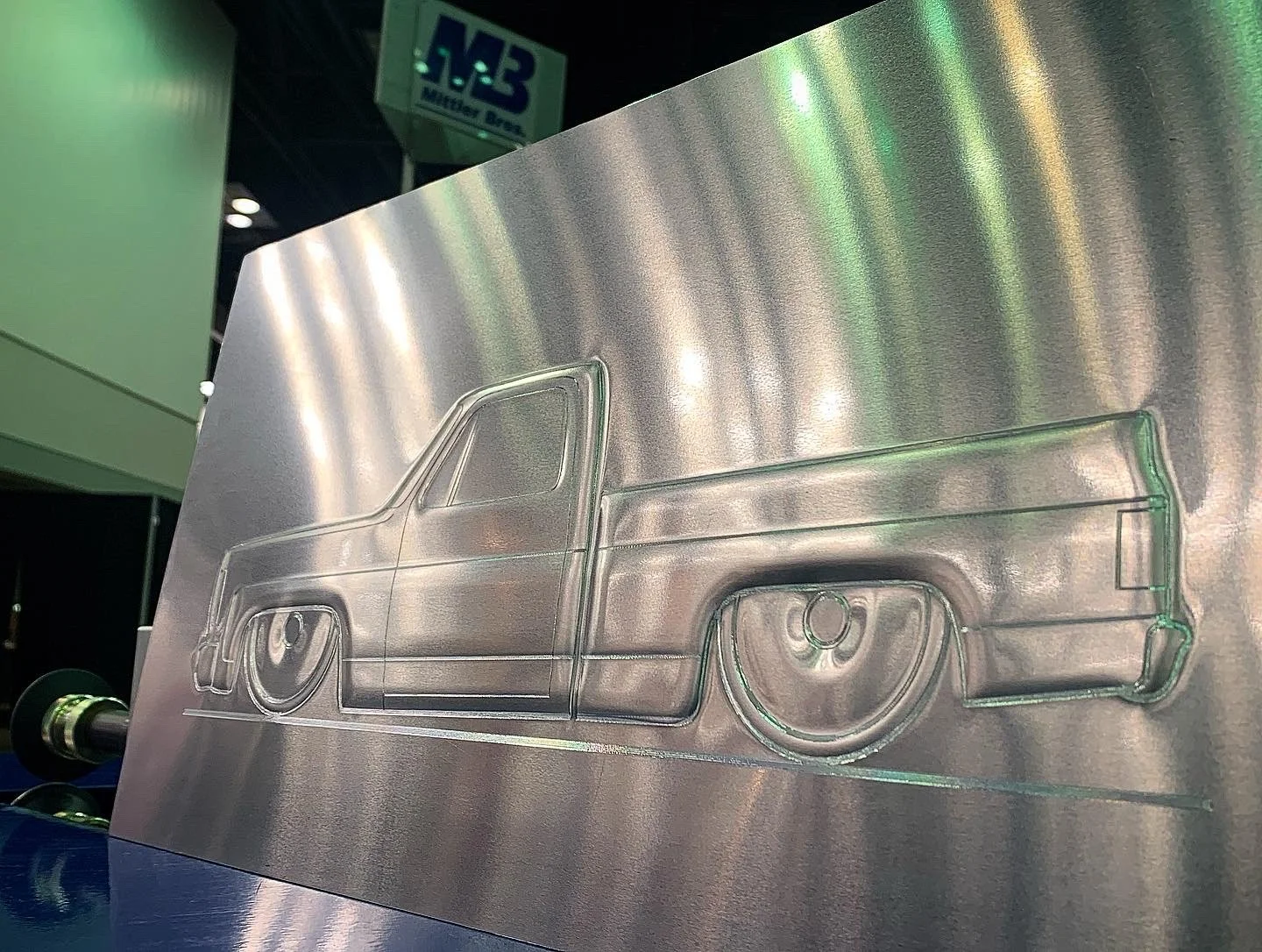A metal sheet bead rolled with an outline of a C10 pickup truck.