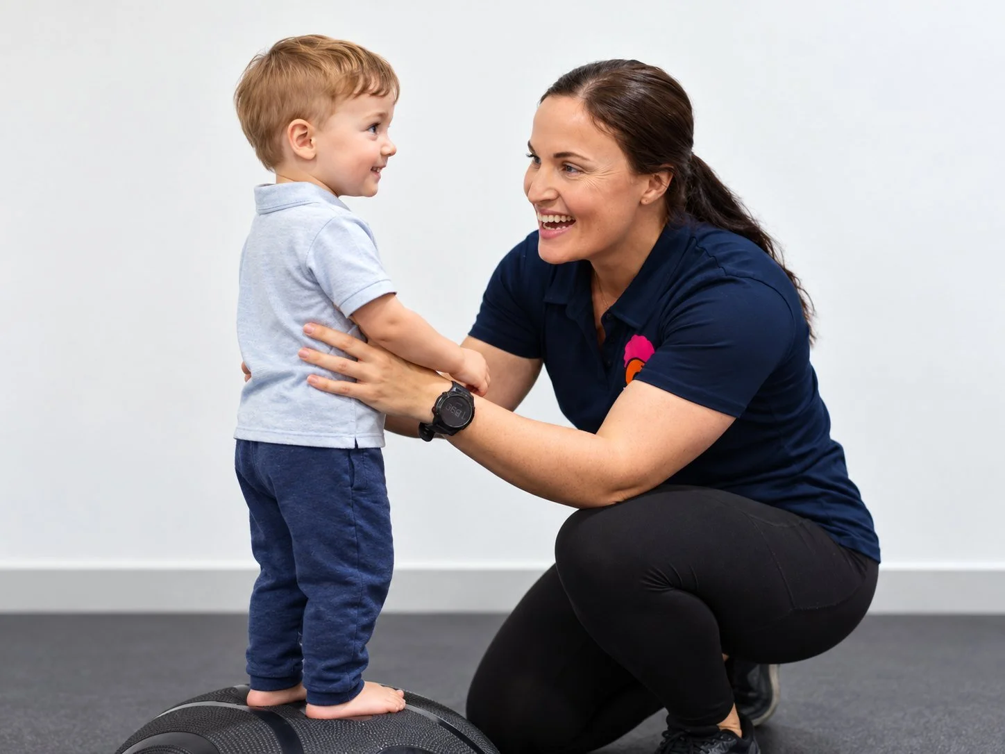 Therapist reading a picture book with a toddler