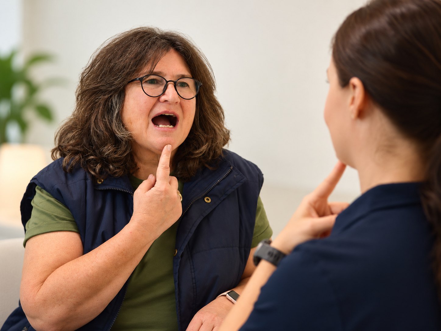 Client practising a speech sound with her speech pathologist