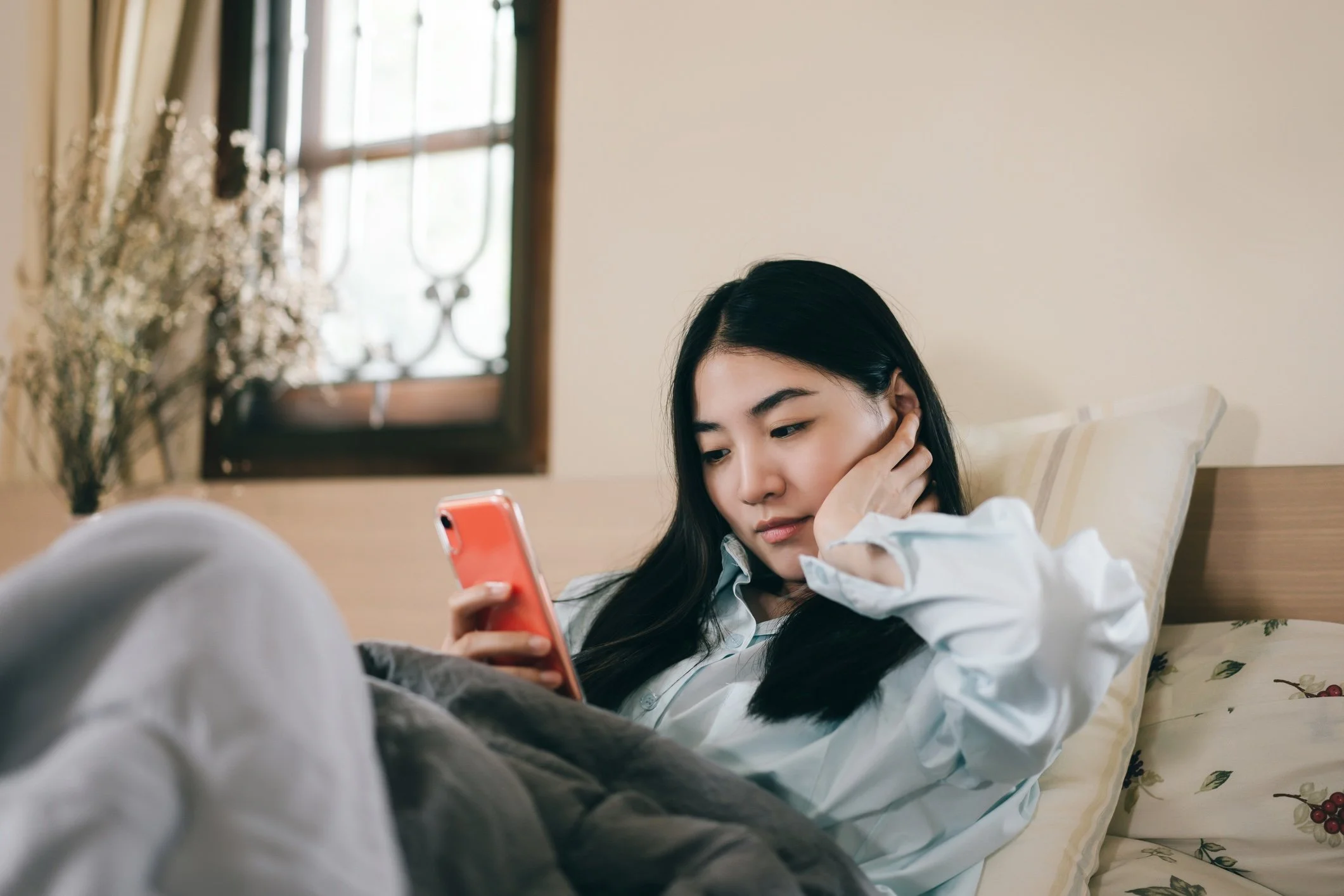Young woman looking at her phone