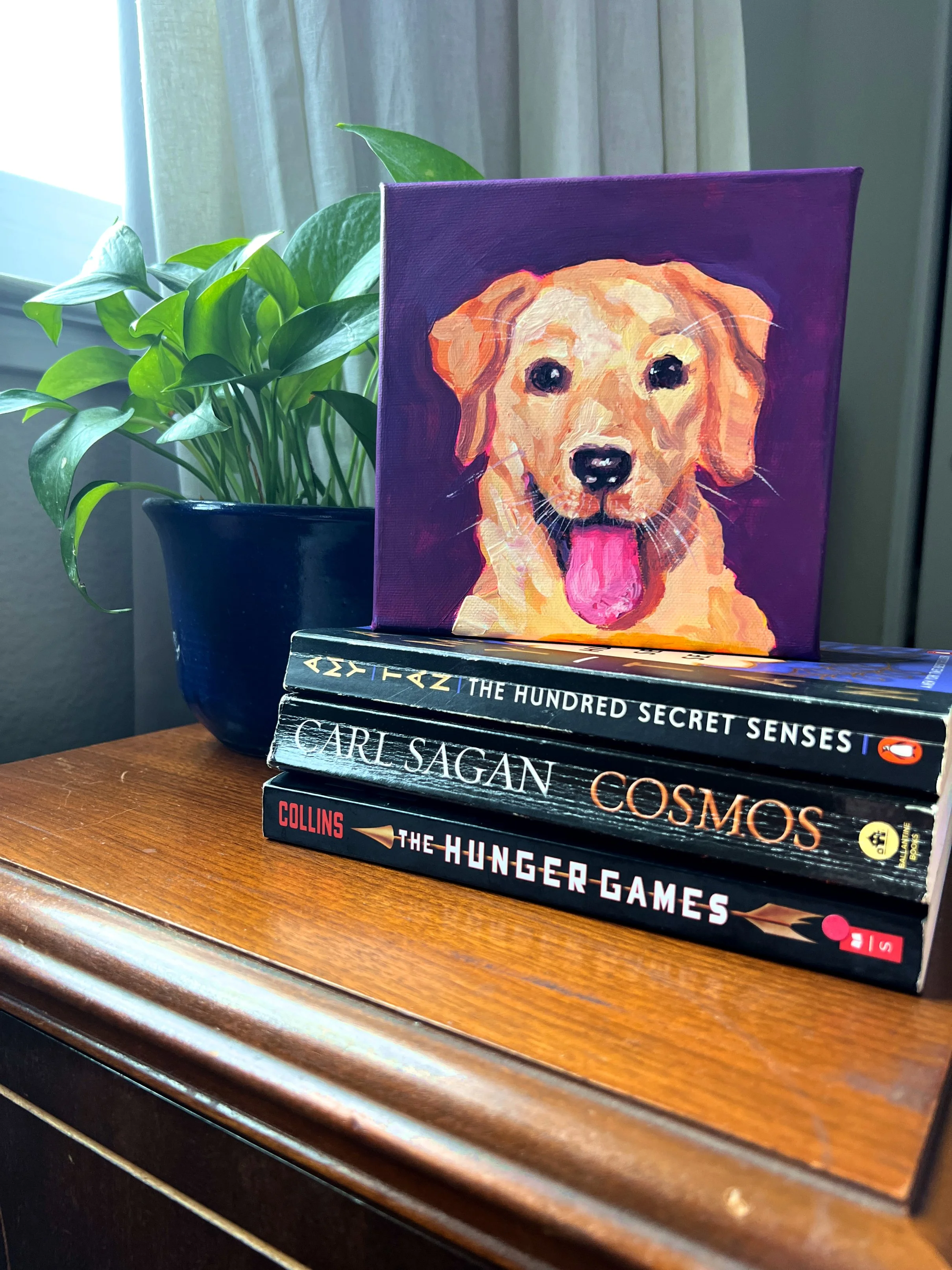 Goldie with books.jpg