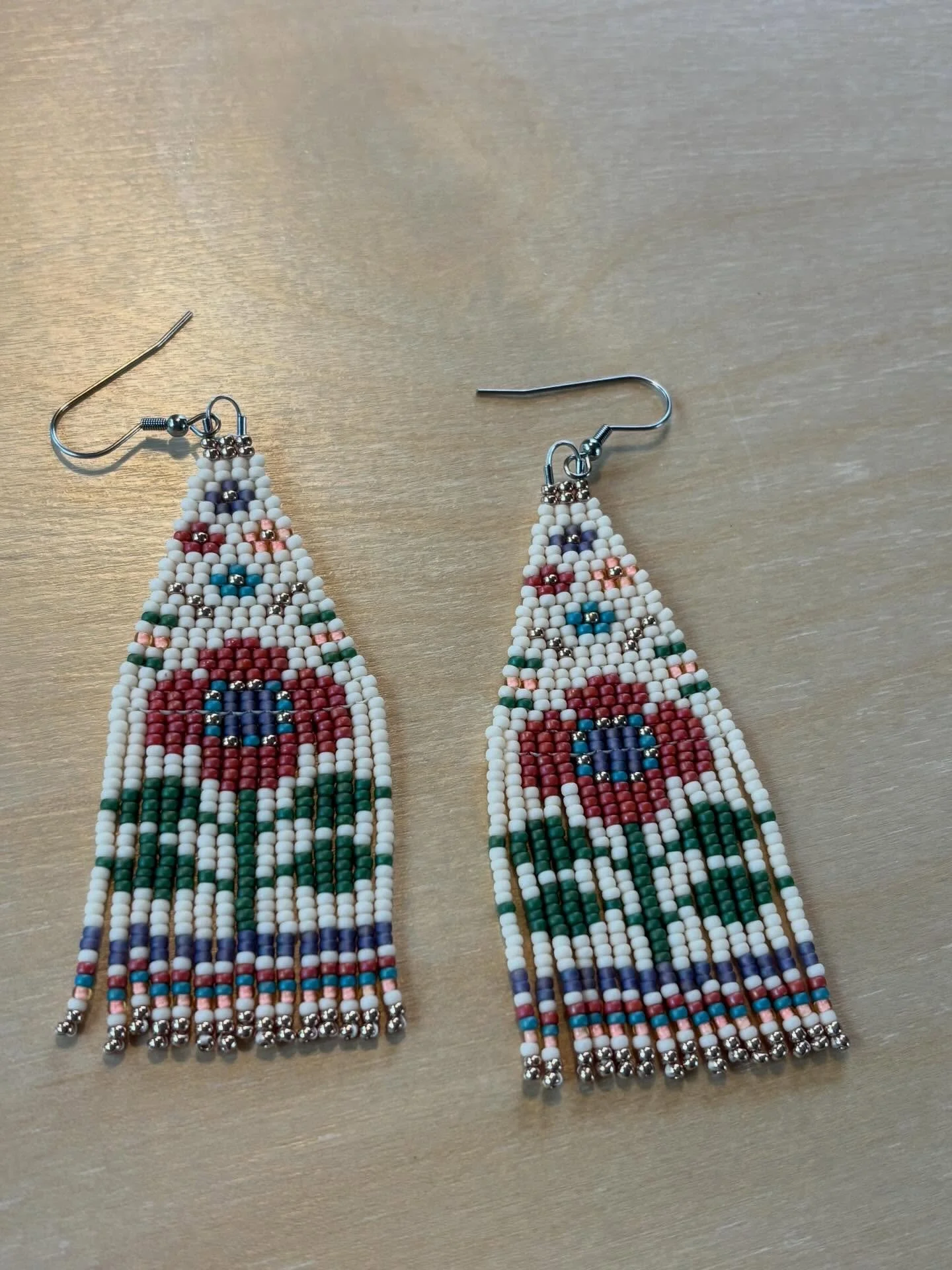 A little folk floral moment, stitched in beads 🌼

This pair was made for someone special&mdash;one of a kind for now&hellip; but I had too much fun with this design to stop at just one.

More of these tapestry-inspired blooms are coming in my spring