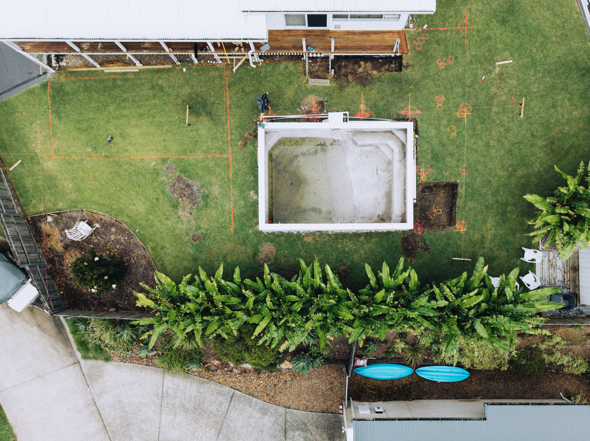 Man using a circular saw on wood outdoors
