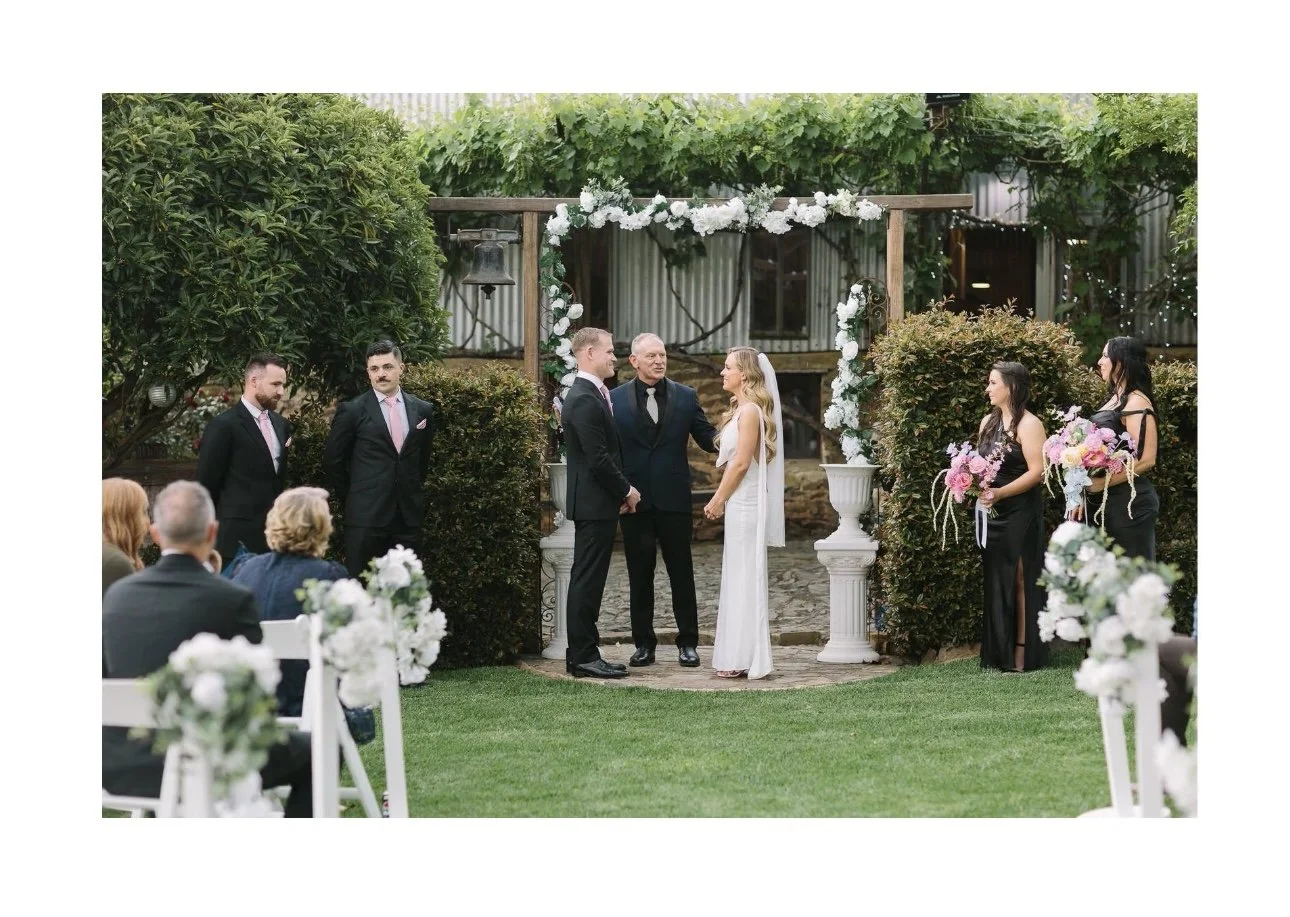 Bride and Groom under the arbor. before the rain came