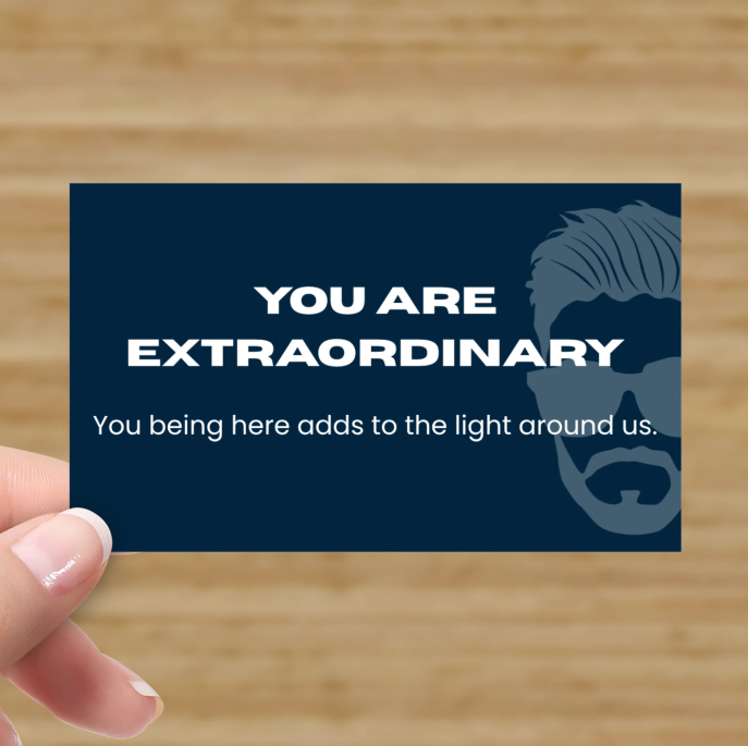 image.pngaNavy Kindness Card front reading You are Extraordinary, held in a hand