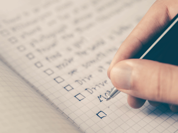 Person checking off items on a checklist that is about everyone else and not their own needs