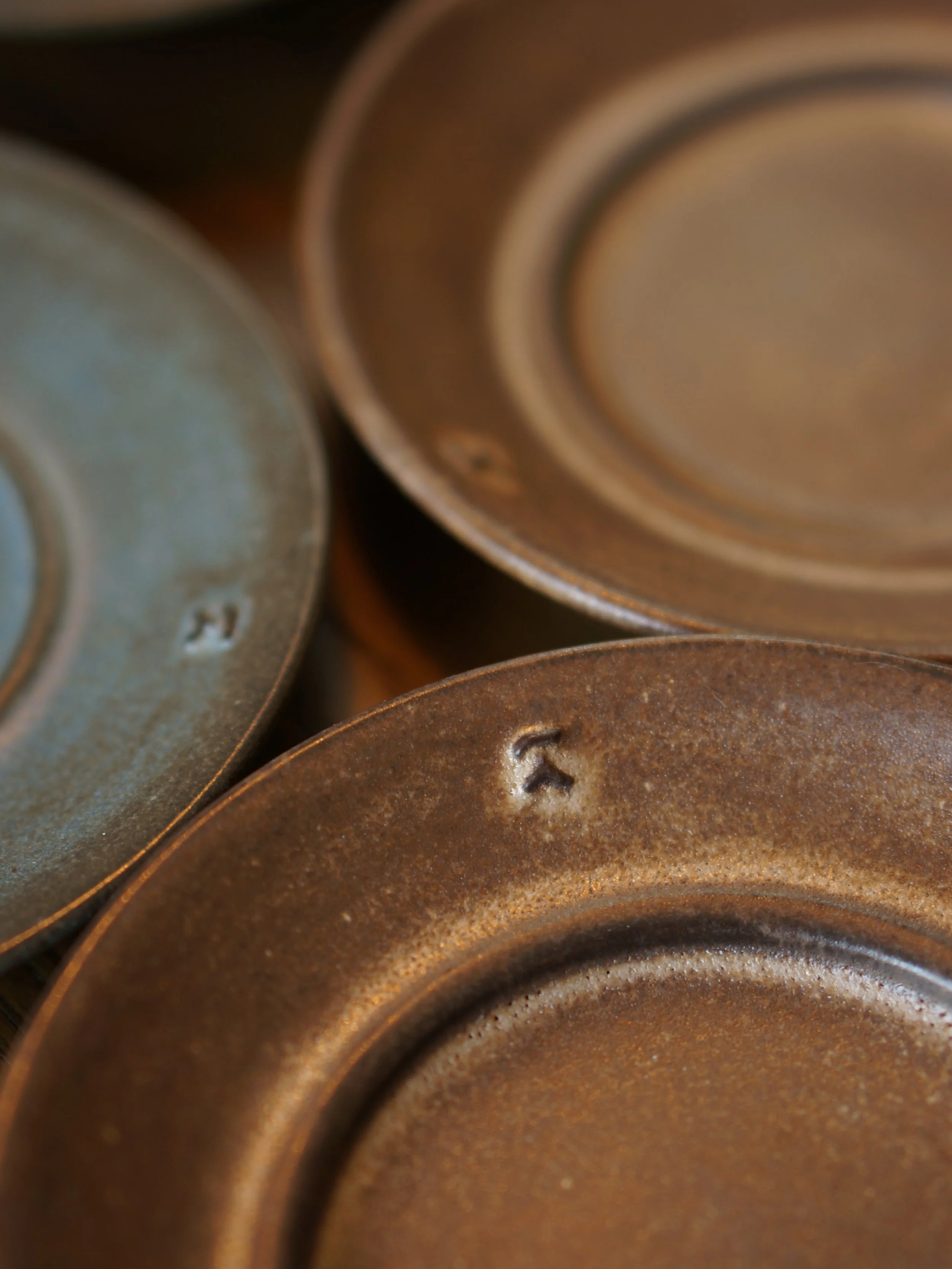 My new test saucers straight from the kiln! I absolutely LOVE how these came out and my chestnut glaze continues to amaze me. Initially I wanted to trim a small well for the cup&rsquo;s foot to slot into, but I didn&rsquo;t like the look of essential