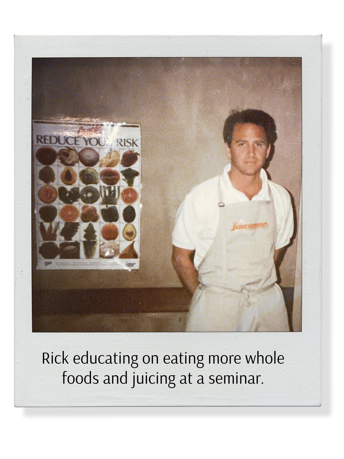 A man wearing a white apron standing in front of a chart titled "Reduce Your Risk" showing various foods. The caption reads, "Rick educating on eating more whole foods and juicing at a seminar."