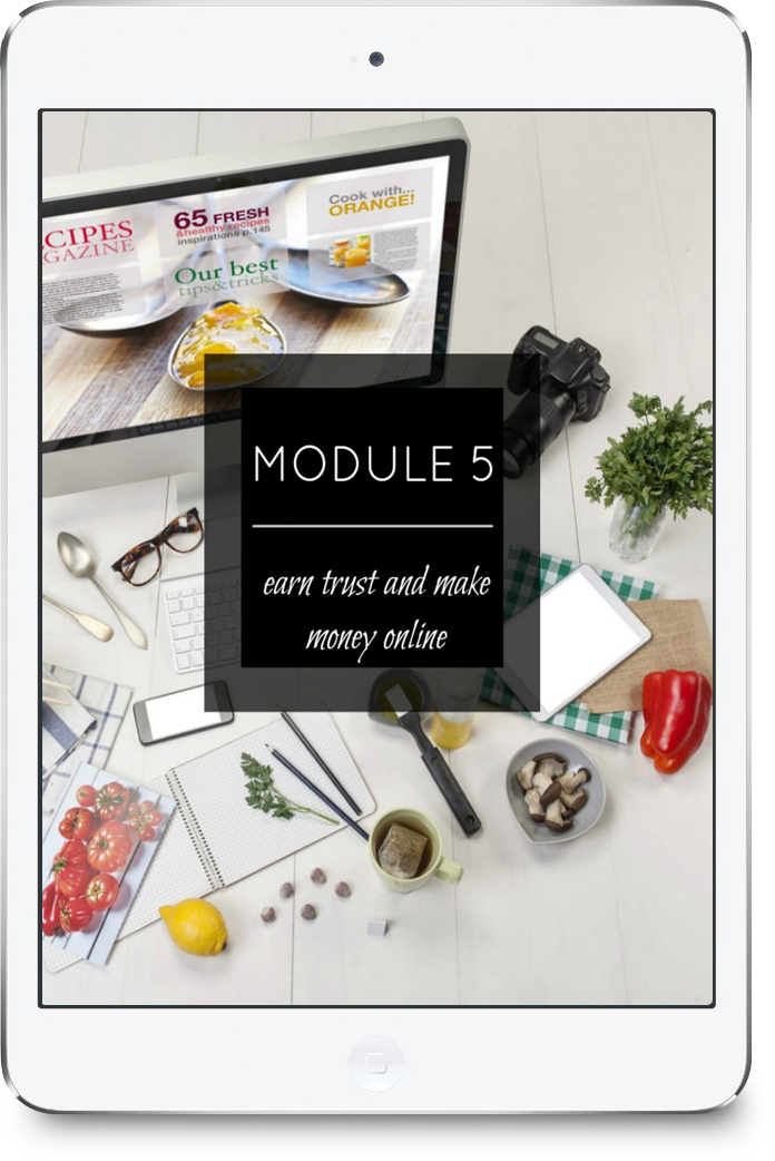 An electronic tablet displaying a class module titled 'MODULE 5' with the subtitle 'earn trust and make money online.' Surrounding the tablet are various items on a white wooden surface, including a camera, a potted plant, a red bell pepper, a lemon, a mug, a bowl of chocolates, a smartphone, a notepad, a white tablet, a spoon, a pair of glasses, and food illustrations on paper.