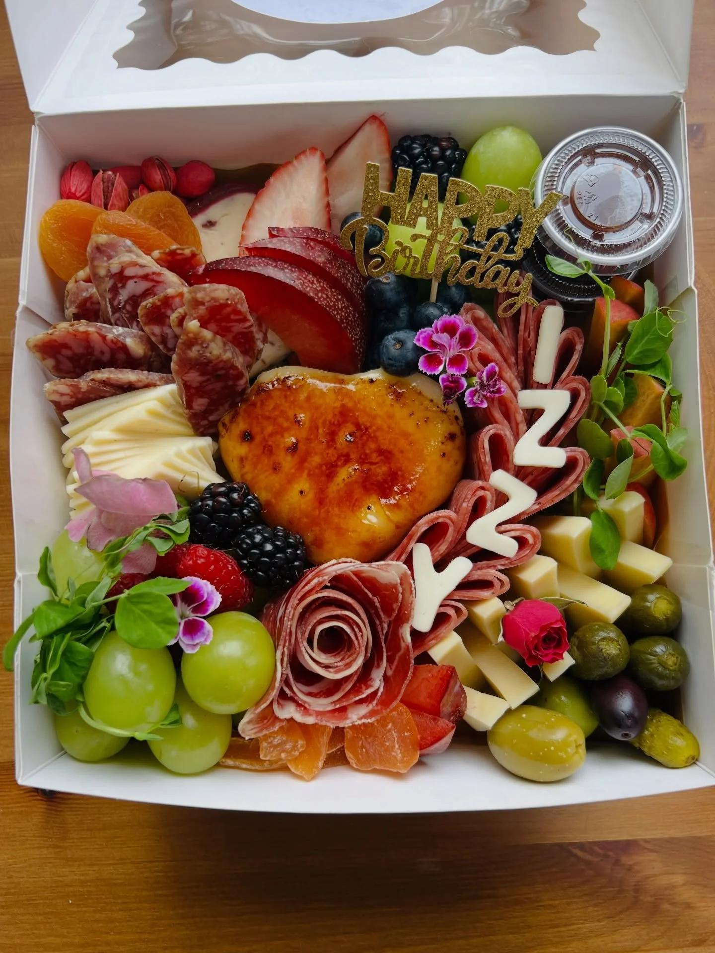 Introducing a new way to customize your order! 🧀✂️

Want a little extra love on your board? Now you can add a personalized touch to any order &mdash; a happy birthday sign with their name spelled out in hand-cut cheese letters, or a happy anniversar