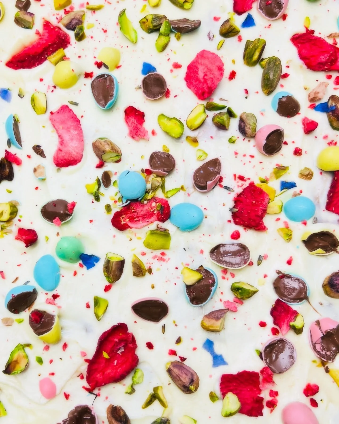 🐣 New on the menu for Spring &mdash; Easter Crack! 

🍓 Buttery toffee and smooth white chocolate on a crispy saltine cracker base, topped with mini chocolate eggs, freeze-dried strawberries, pistachios, and edible flower petals. 🌺

Crunchy, sweet,